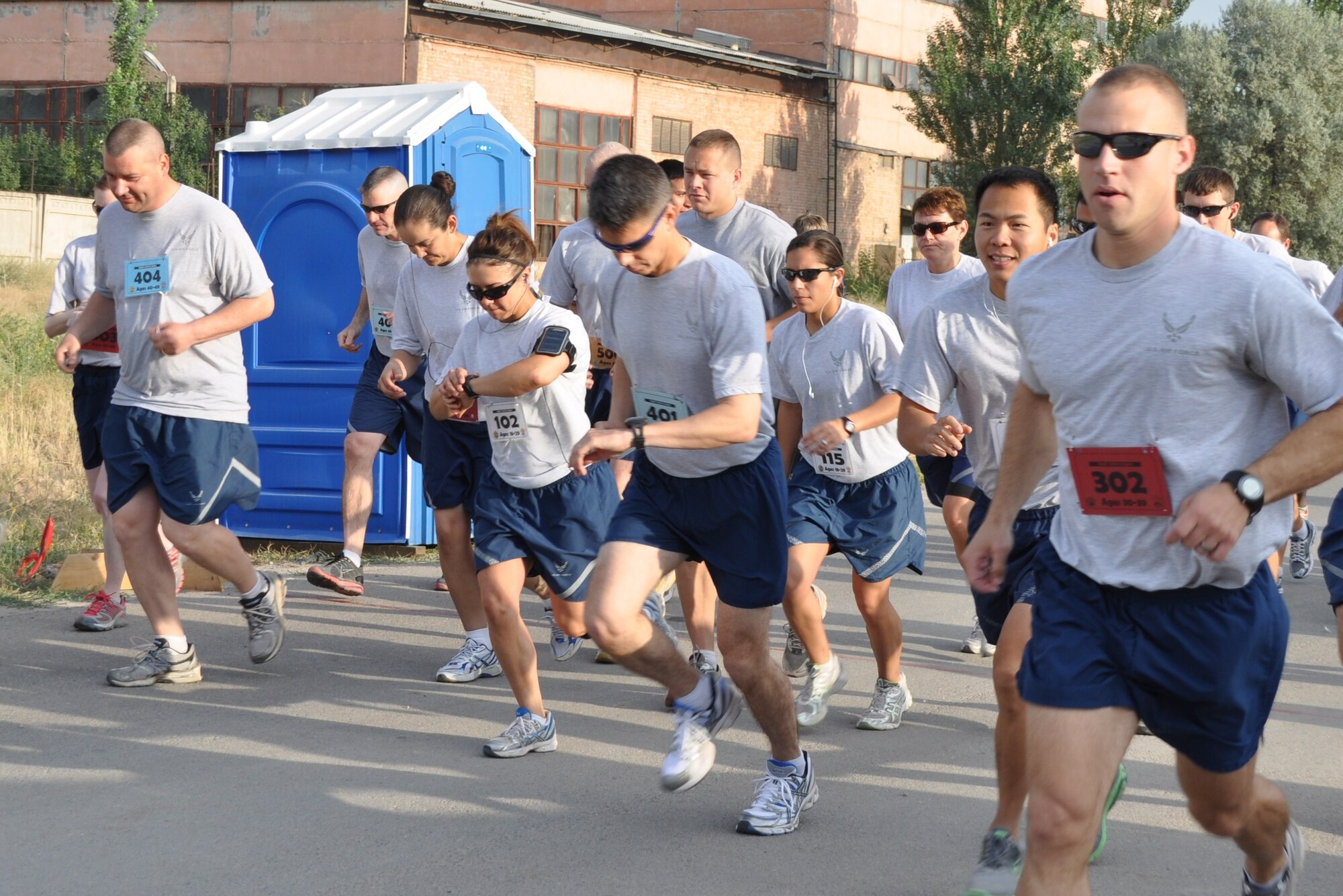 Runners from the 376th Air Expeditionary Wing begin a half-marathon race at the Transit Center at Manas, Kyrgyzstan, Aug. 8. The race provided runners a chance to determine where they stand in their preparation for the Air Force Marathon takes place here Sept. 17. (U.S. Air Force photo/Senior Airman Chelsea Zalduondo)