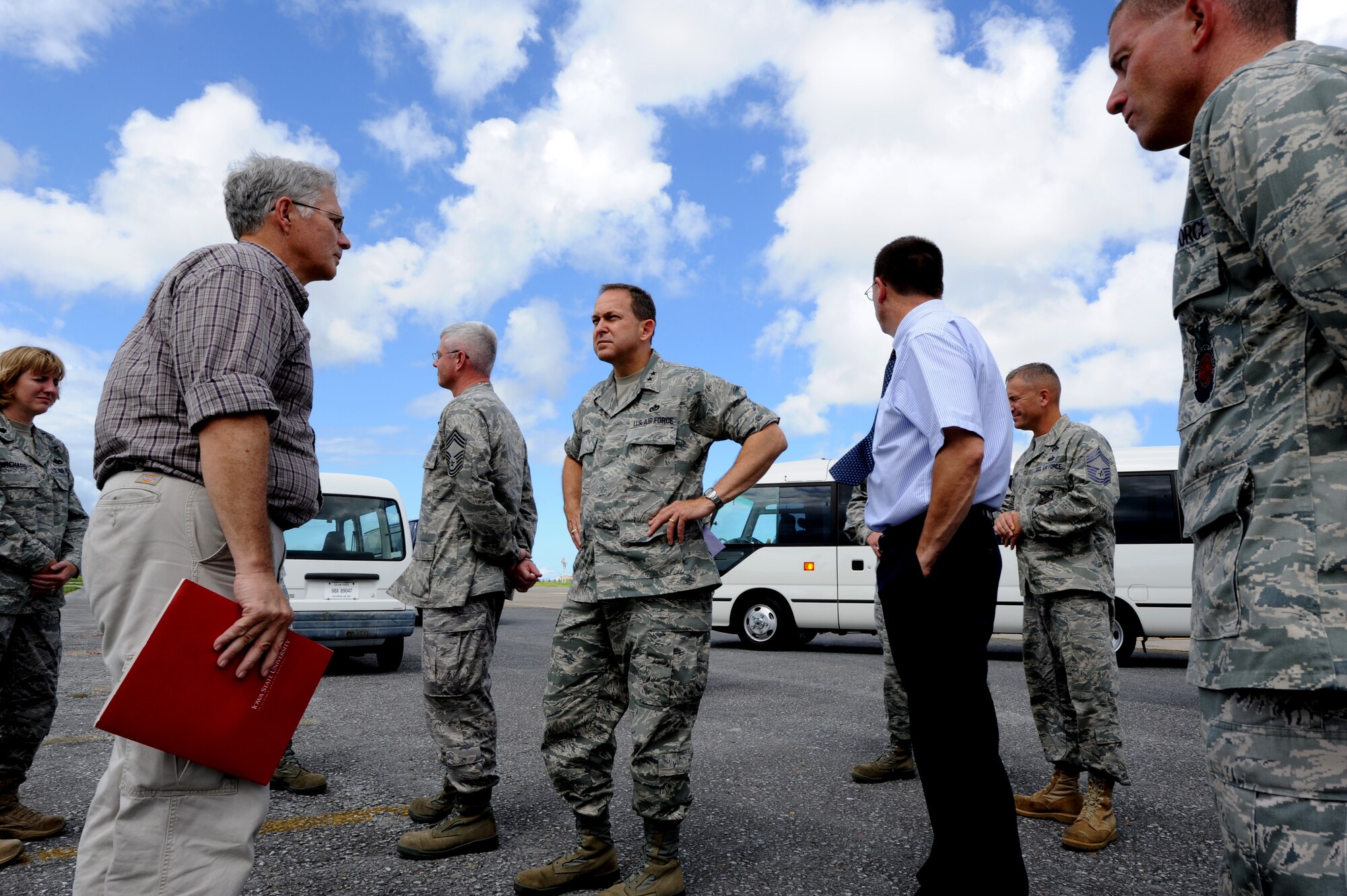 Kevin Rogers, 718th Civil Engineer Squadron project manager, discusses Kadena's ongoing $17 million runway repair project with Maj. Gen. Timothy A. Byers, Air Force Civil Engineer, and Chief Master Sgt. Pat Abbott, Office of the Civil Engineer, chief of enlisted matters, during Byers' and Abbott's visit to Kadena Air Base, Japan, in July. Kadena's south runway recently opened after being closed for nine months to undergo extensive concrete and asphalt repairs, installation of new airfield lighting and markings, and upgrades to the aircraft arresting systems. (U.S. Air Force photo/Airman 1st Class Jarvie Z. Wallace)