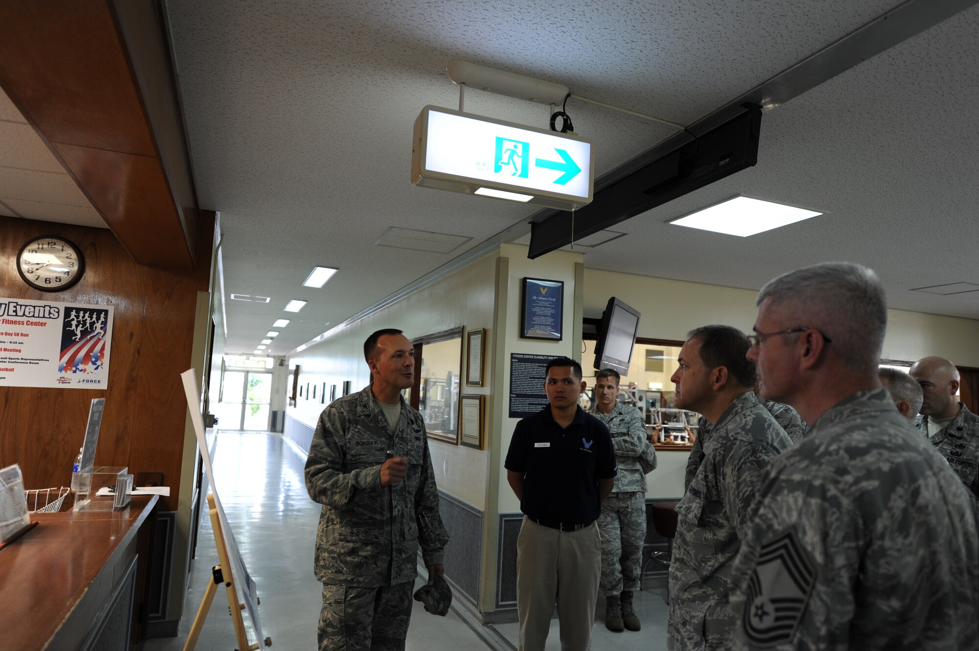 Col. Mike Borgert, 18th Force Support Squadron commander, and Staff Sgt. Ronald Gamo, fitness center supervisor, describe use rates at the Risner Fitness Center to Maj. Gen. Timothy A. Byers, Air Force Civil Engineer, during Byers' visit to Kadena Air Base, Japan, in July, to help demonstrate the need for the base's proposed $34million, 45,000 square-foot expansion and 65,000square-foot renovation project. More than 88,000 visitors use the Risner Fitness Center each month. (U.S. Air Force photo/Airman 1st Class Jarvie Z. Wallace)