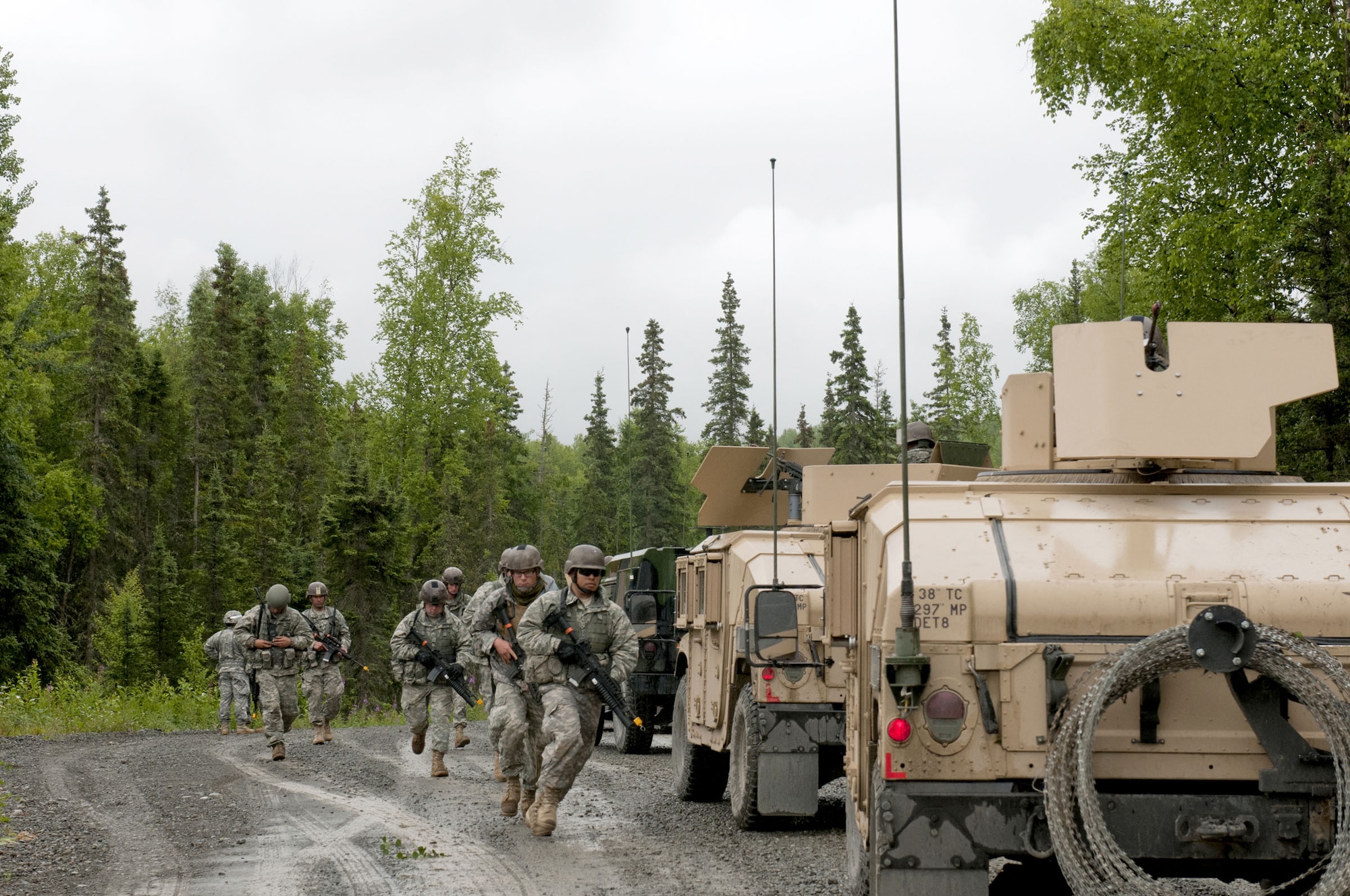 Alaska Army National Guard Spc. David Smart, team leader, and Pvt. Dakota Rajala,
rifl eman, both of 3rd Platoon, B/1-143rd, lead the way during a simulated near-ambush attack. The unit spent three weeks conducting pre-deployment training and validation to prepare for their deployment to Afghanistan scheduled this fall. Smart is a resident of Hooper Bay and Rajala is from Fairbanks. (U.S. Army photo/Staff Sgt. Karima Turner)
