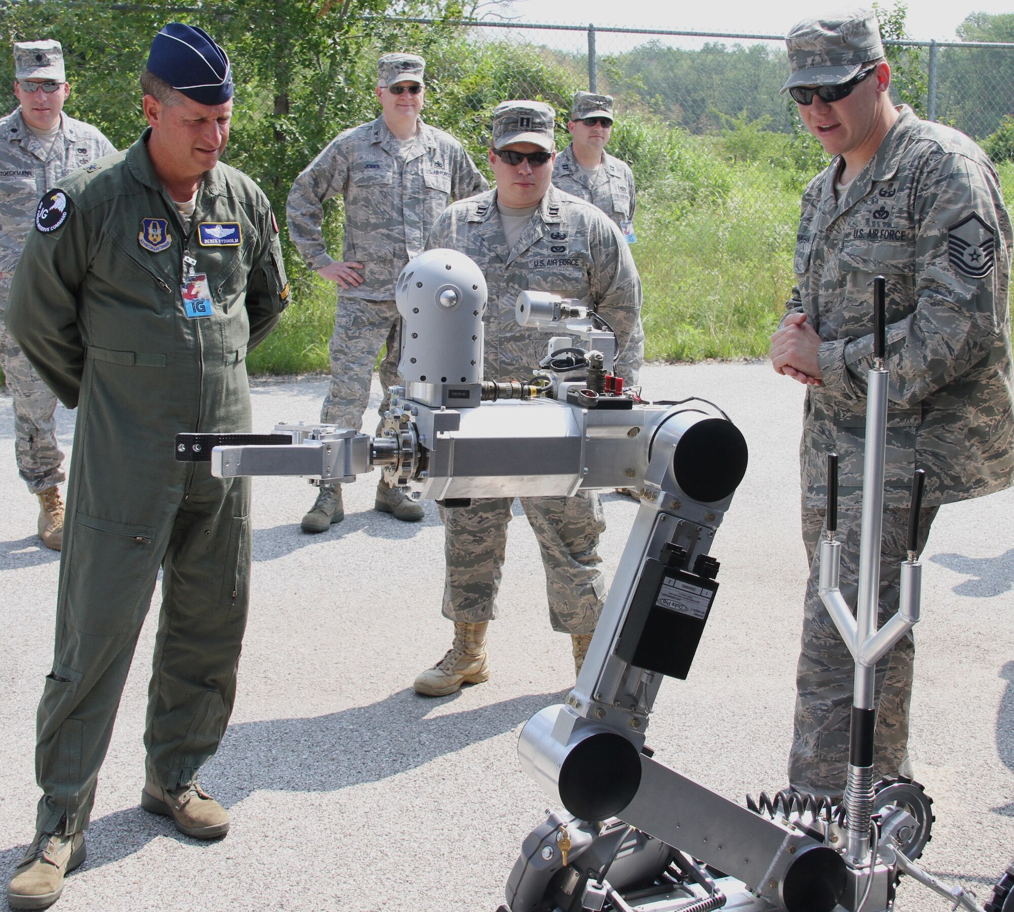 Brig. Gen. Derek Rydholm listens as Master Sgt. David Pinkham talks about the capabilities of the 932nd Civil Engineer Squadron (EOD) newest robot.  General Rydholm was at the 932nd AW leading an Air Force Reserve Command UCI team that evaluated operations, maintenance and mission support activities. (U.S. Air Force photo/Tech. Sgt. Christopher Parr)