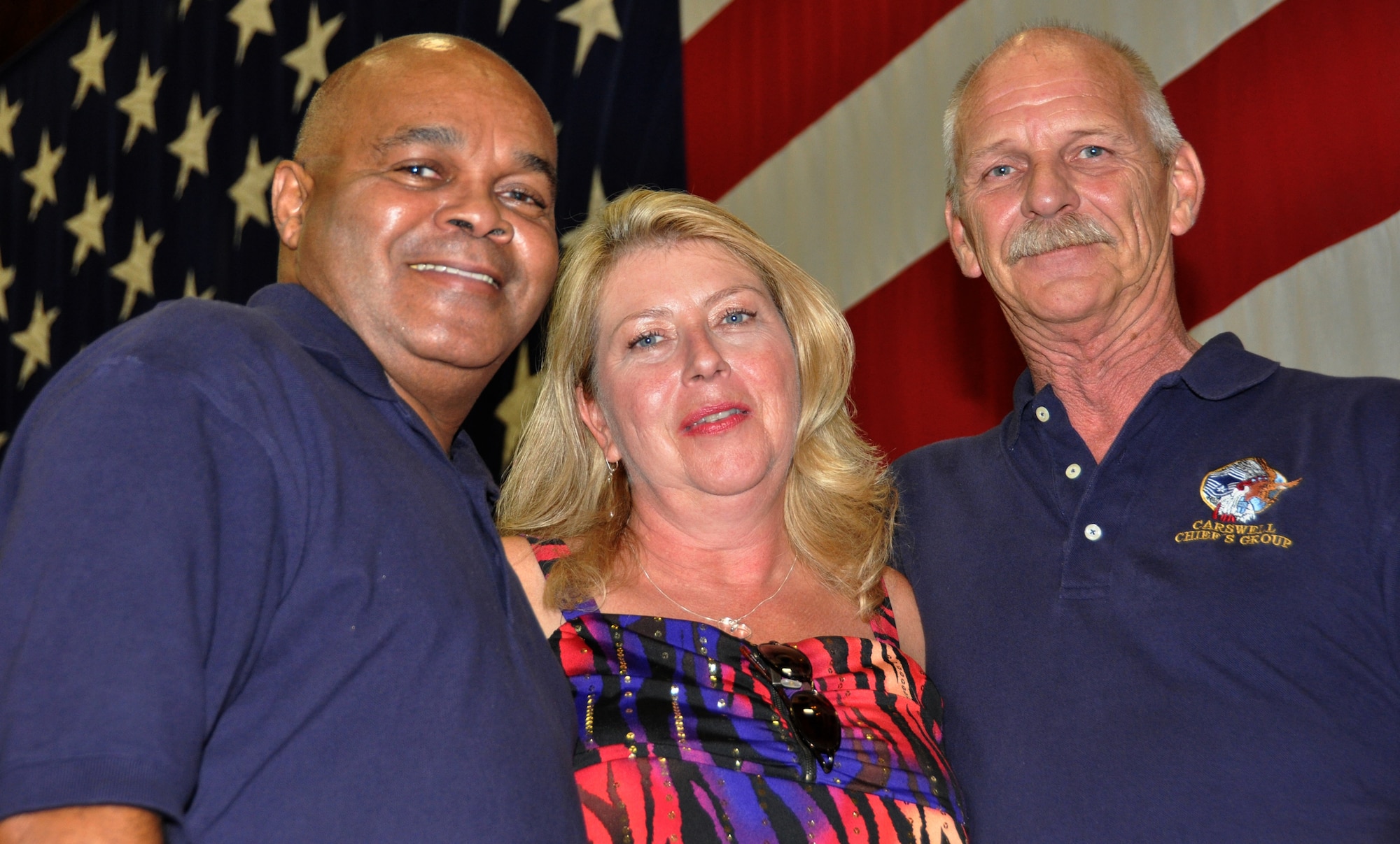 Left to right, Retired Chief Master Sgt. Bob Murphy, Chief Master Sgt. Michele Ozuna and Retired Chief Master Sgt. Ron Carroll are all smiles at the 73rd Aerial Port Squadron's 40th Anniversary celebration Aug. 6, 2011, at Naval Air Station Joint Reserve Base, Texas.  Ozuna is the current superintendent of the squadron while Murphy and Carroll are former superintendents.  (U.S. Air Force photo/Lt. Col. David Kurle)