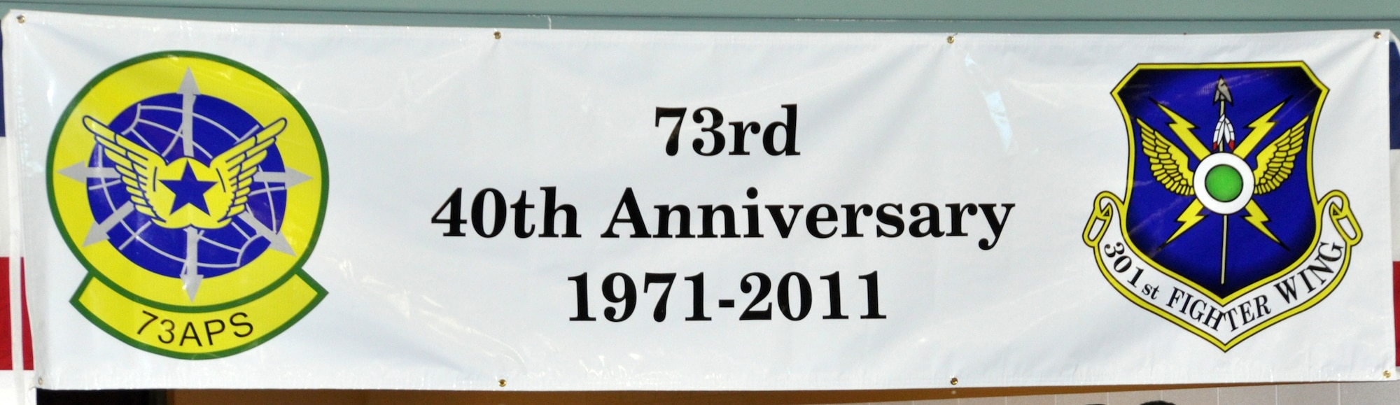 A banner, specially made for the 73rd Aerial Port Squadron, hangs over the unit's 40th Anniversary celebration Aug. 6, 2011, at Naval Air Station Fort Worth Joint Reserve Base, Texas.  (U.S. Air Force photo)