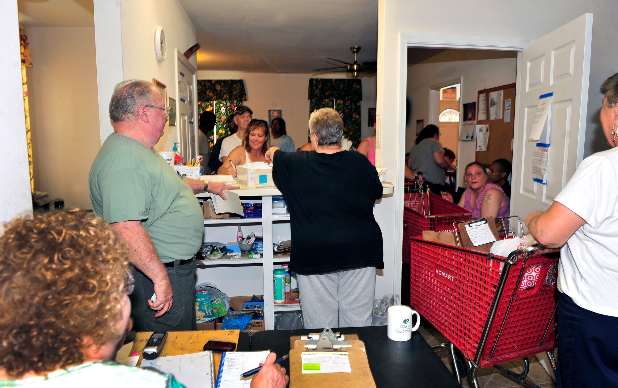 Volunteers at the Community Interfaith Food Pantry in Belleville, Ill., take grocery orders from individuals in need Aug. 5, 2011.  Many of the food donations for the pantry come from people at nearby Scott Air Force Base who are participating in the Department of Defense “Feds Feed Families” campaign.  The campaign has challenged participants to gather two million pounds of food during the summer. Food banks across the country are facing severe shortages of non-perishable items while children are left without school nutrition programs in the summer months. (U.S. Air Force photo/ Staff Sgt. Stephenie Wade)