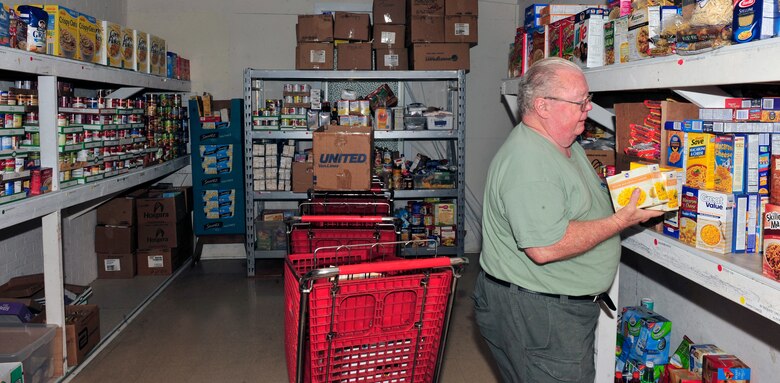 Retired Chief Master Sgt. Jerry Messick, the director of the Community Interfaith Food Pantry in Belleville, Ill., puts away boxes of donated non-perishable items Aug. 5, 2011. During the month of August people from nearby Scott Air Force Base are stepping up to do their part to help meet the challenge of gathering two million pounds of food during the Department of Defense “Feds Feed Families” campaign. Food banks across the country are facing severe shortages of non-perishable items while children are left without school nutrition programs in the summer months. (U.S. Air Force photo/Staff Sgt. Stephenie Wade)