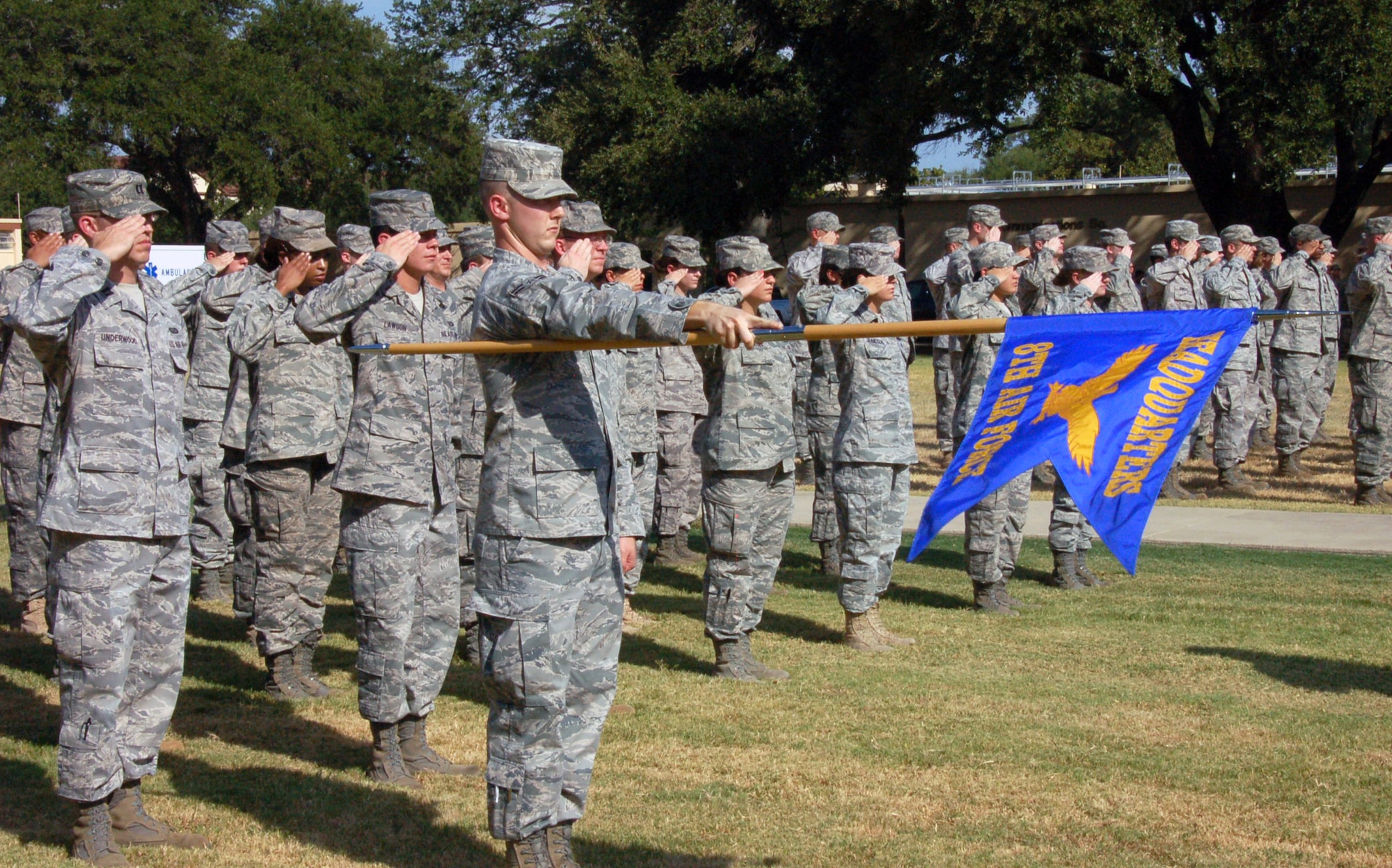 BARKSDALE AIR FORCE BASE, La. - Members of the Eighth Air Force Headquarters participate in a retreat ceremony with the 2nd Medical Group Aug.10, 2011, at Barksdale Air Force Base, La. The retreat ceremony serves a twofold purpose. It signals the end of the official duty day and serves as a ceremony for paying respect to the flag. When persons not assigned to a formation are outdoors and in uniform, on the first note of retreat, they should face the flag (if visible) or music and assume the position of parade rest. (U.S. Air Force photo by Staff Sgt. Brian Stives)