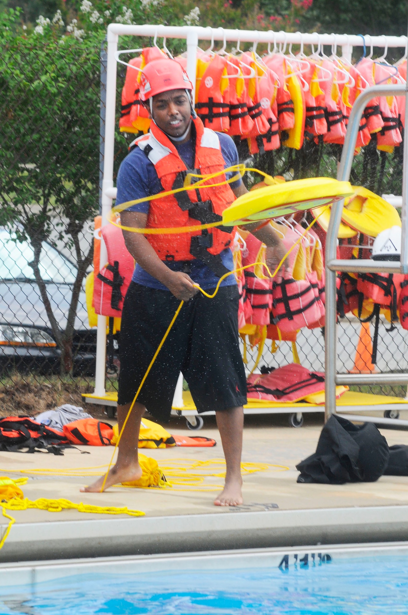 Marcus White practices throwing a personal retriever device to a simulated victim during Robins Fire Department's Basic Introductory Water Rescue course. U. S. Air Force photo by Sue Sapp