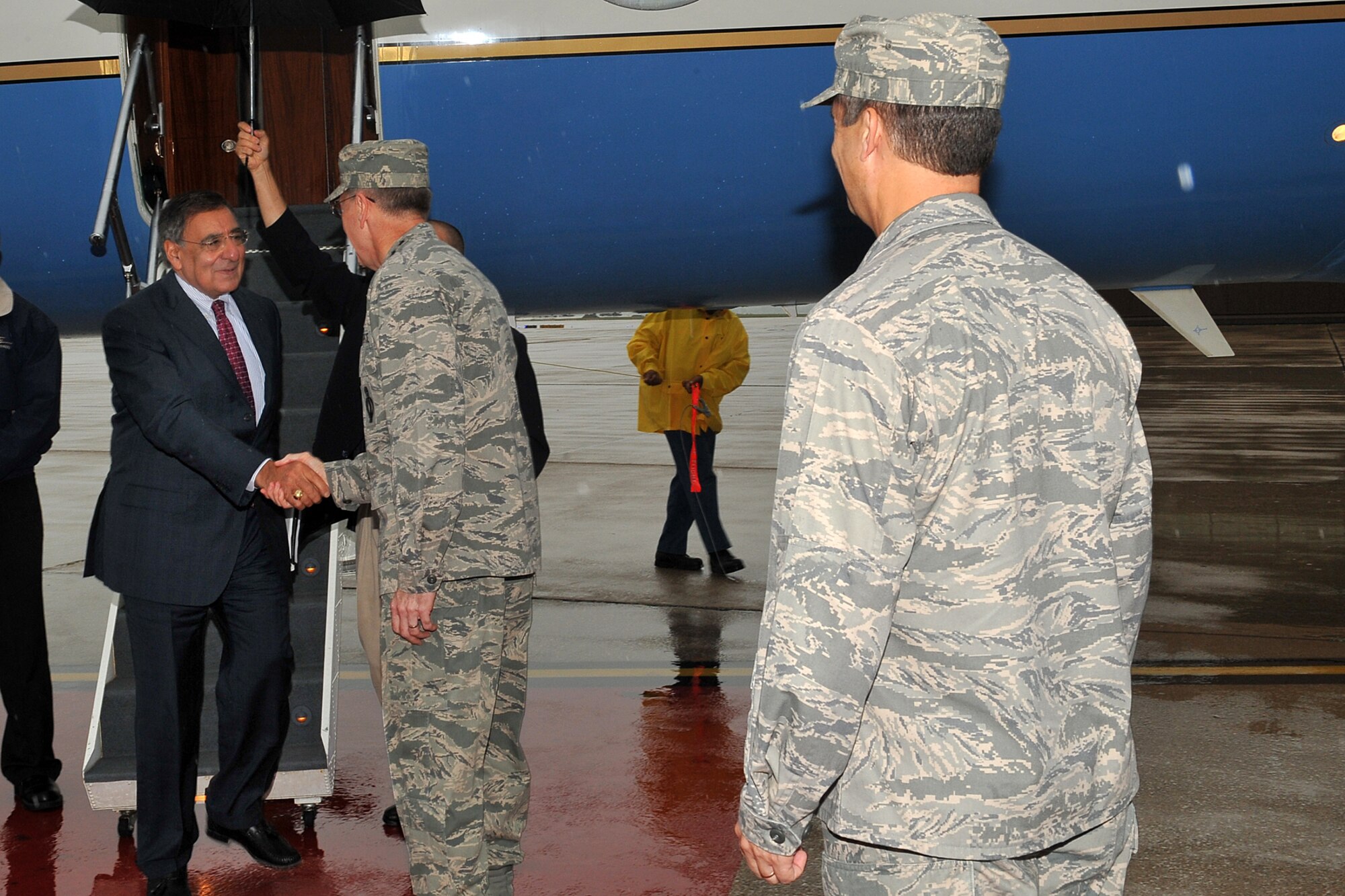 Secretary of Defense Leon Panetta, is greeted by Air Force Gen. C. Robert Kehler, U.S. Strategic Command commander, at the Base Operations building on Offutt Air Force Base, Neb., Aug. 5. Panetta came to Offutt to visit U.S. Strategic Command leadership and Service members. (U.S. Air Force Photo by Charles Haymond)