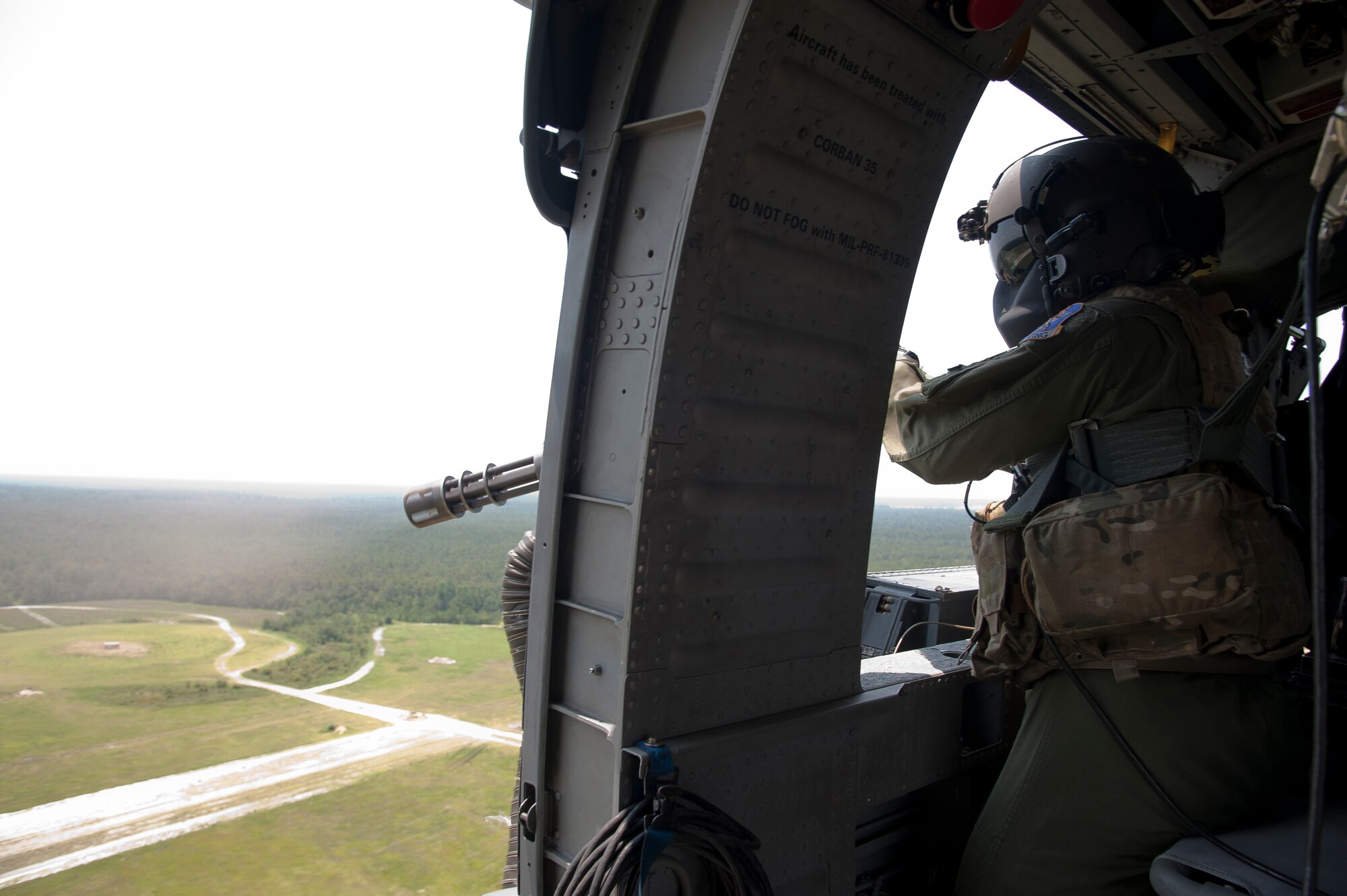 U.S. Air Force Airman 1st Class Henry Flores, 41st Rescue Squadron aerial gunner, engages pop-up targets at Grand Bay Bombing and Gunnery Range, Ga., Aug. 3, 2011. HH-60G Pave Hawk aerial gunners are tasked with protecting their crew at all costs by suppressing and neutralizing hostile forces. (U.S. Air Force photo by Airman 1st Class Jarrod Grammel/Released)
