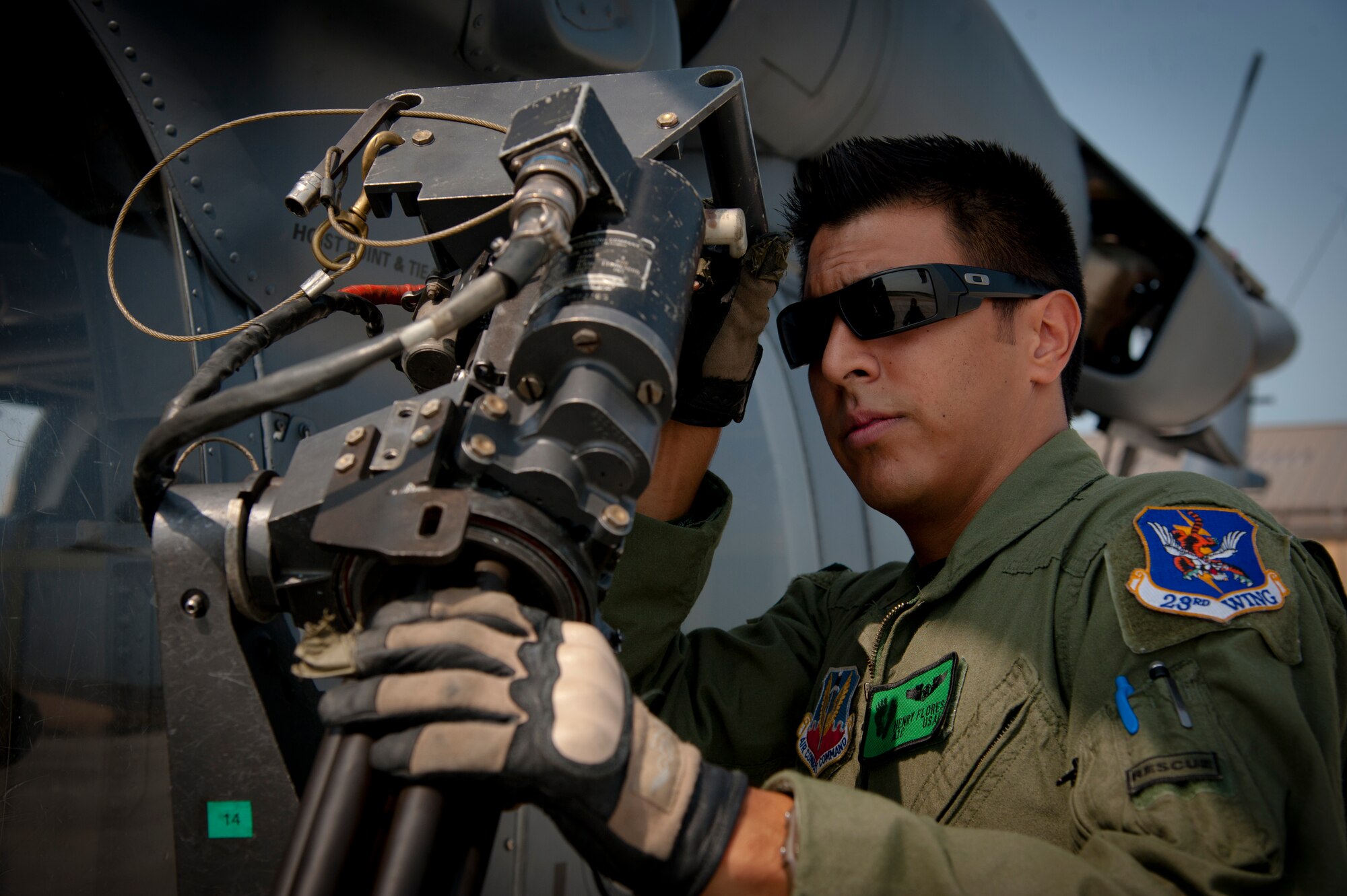 U.S. Air Force Airman 1st Class Henry Flores, 41st Rescue Squadron aerial gunner, inspects a GAU-2/A 7.62mm minigun during a pre-flight inspection at Moody Air Force Base, Ga., Aug. 3, 2011. Before taking off, aerial gunners thoroughly inspect their weapons and the aircraft to ensure it is mission-ready. (U.S. Air Force photo by Airman 1st Class Jarrod Grammel/Released)
