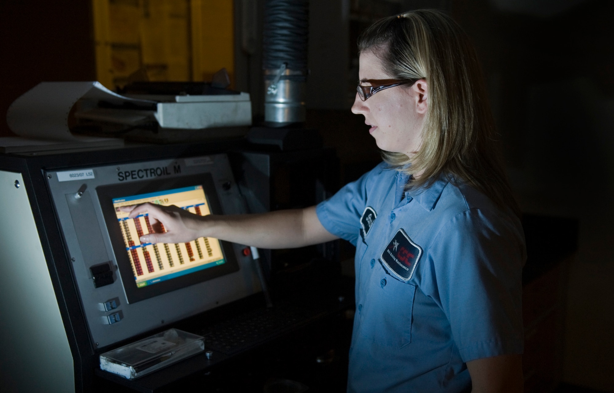 Stephanie Zvonik, Computer Science Corporation aircraft mechanic 1 nondestructive inspection technician, performs a joint oil analysis for aircraft oils, Aug. 5, 2011, at Nellis Air Force Base, Nev.  The analysis of aircraft oils can detect wear of individual parts. Without it, major components can fail going undetected. Zvonik tests up to 80 samples day. (U.S Air Force photo by Senior Airman Stephanie Rubi/Released)