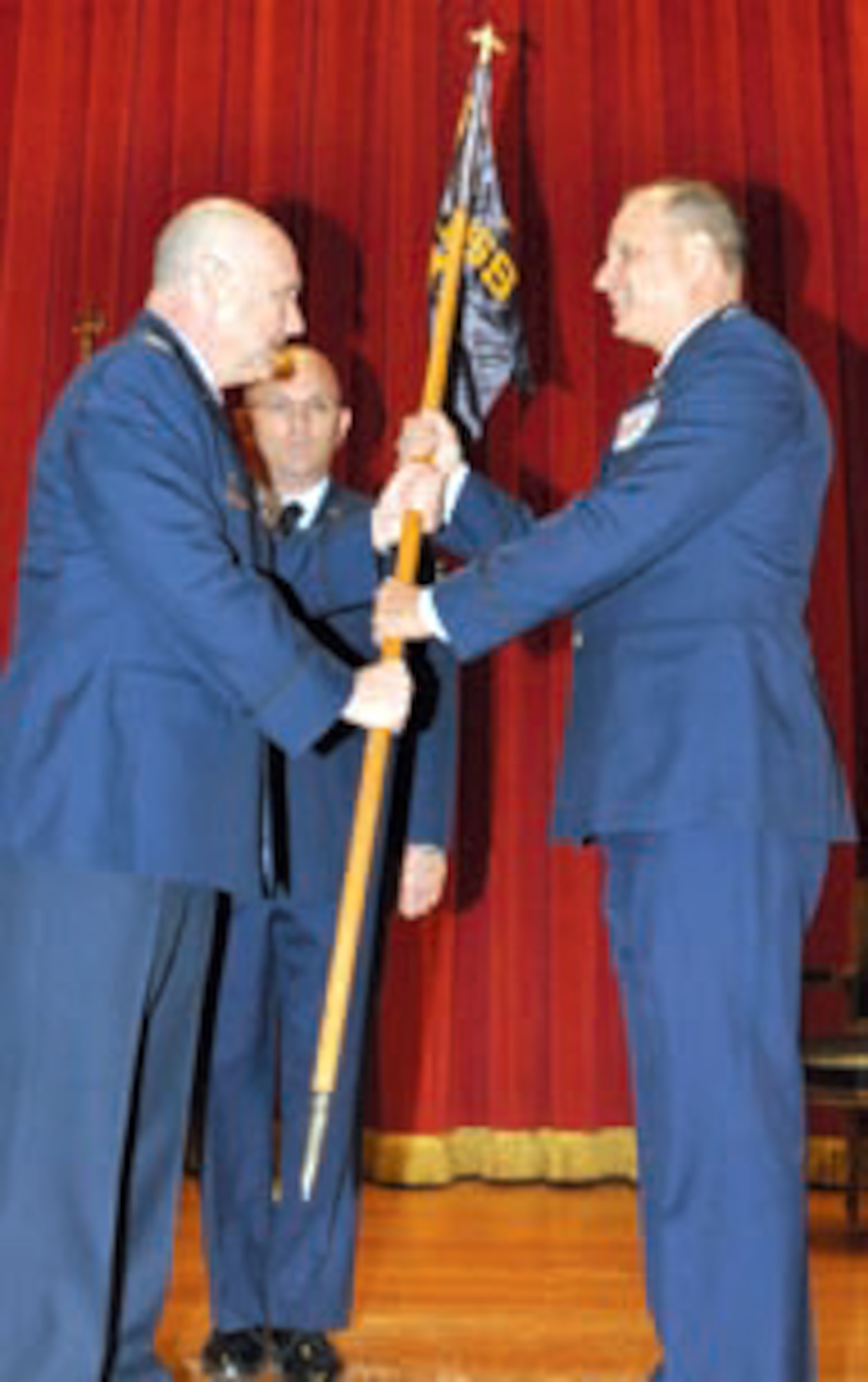 Lt. Col. Shane Lohman (right) assumes command of the 452nd Operations Support Squadron from Col. Mark Sigler, 452nd Operations Group commander during an assumption of command ceremony at the Cultural Resource Center July 23. Family, friends and members of the 452 Operational Support Squadron and 729th Airlift Squadron turned out to witness the event. Before assuming command of the 452 OSS, Lt. Col. Lohman was deputy commander of the 452nd Operations Group. He is rated as a command pilot with more than 4,000 flight hours.  (U.S. Air Force photo)