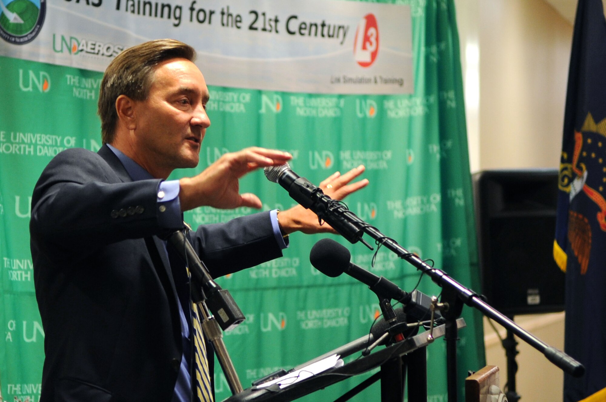 Rep. Rick Berg, congressman from North Dakota, speaks to an audience about the dedication of the University of North Dakota Unmanned Aircraft Systems Training Facility opening up on Grand Forks Air Force Base Aug 10. The UND Unmanned Aircraft Systems Center of Excellence was established in 2006 and focuses on education and training for UAS integration into national airspace systems. . (U.S. Air Force photo by Senior Airman Amanda N. Stencil)