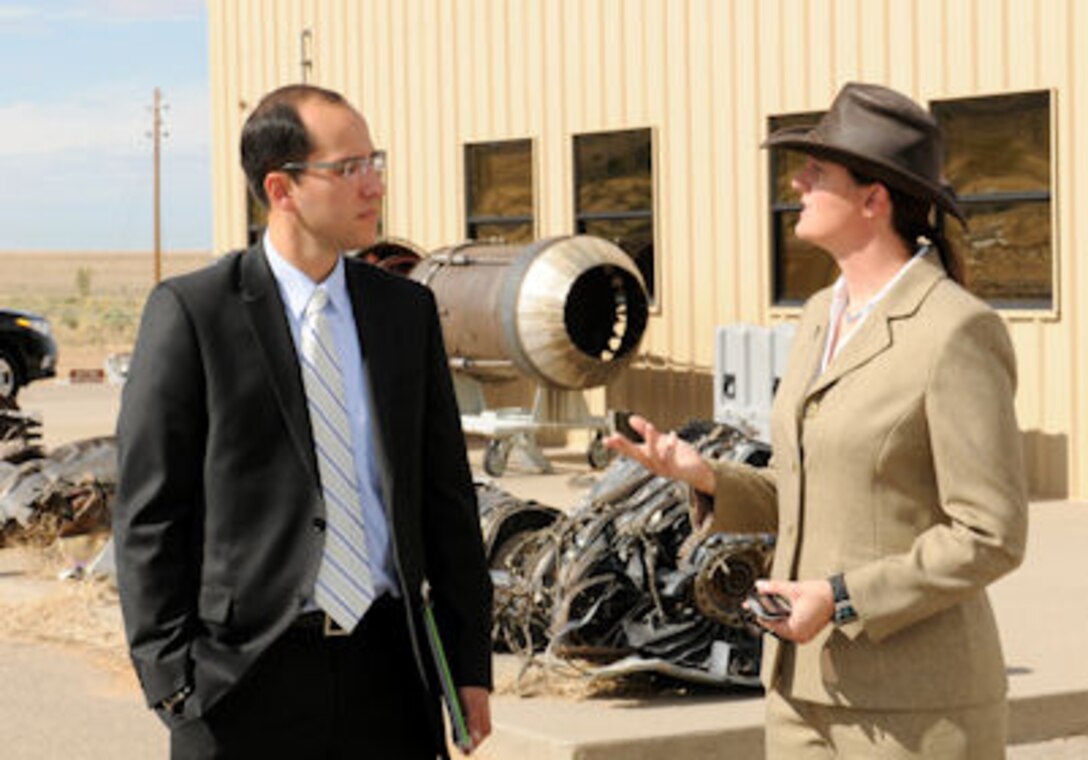 KIRTLAND AFB, N.M.–Antonio Sandoval, constituent liaison to U.S. Rep. Martin Heinrich, and Michele Boyko, Chief, Training Instruction Branch, Air Force Safety Center, discuss instruction offered at the Crash Lab here as part of his visit to base units, Aug. 5. The Crash Lab provides students with hands-on understanding of the aircraft and ground mishap investigation process. (U.S. Air Force photo/Keith Wright)