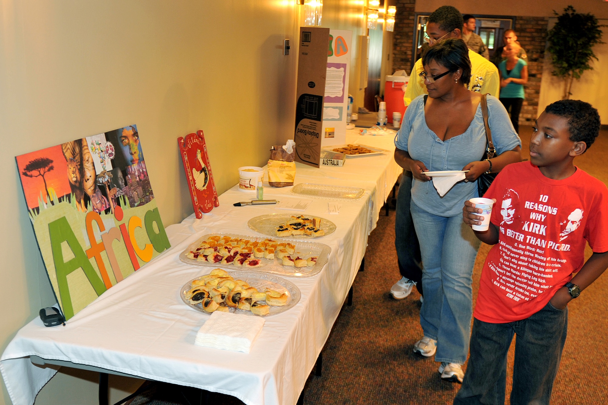 Patrons flow through the line to sample food and learn about their country of origin during the 2011 Diversity Day events on Aug. 5, 2011, at Offutt Air Force Base, Neb.  Diversity Day was held at the Community Center and offered attendees an array of dishes from around the world. (U.S. Air Force photo by Jeff W. Gates)