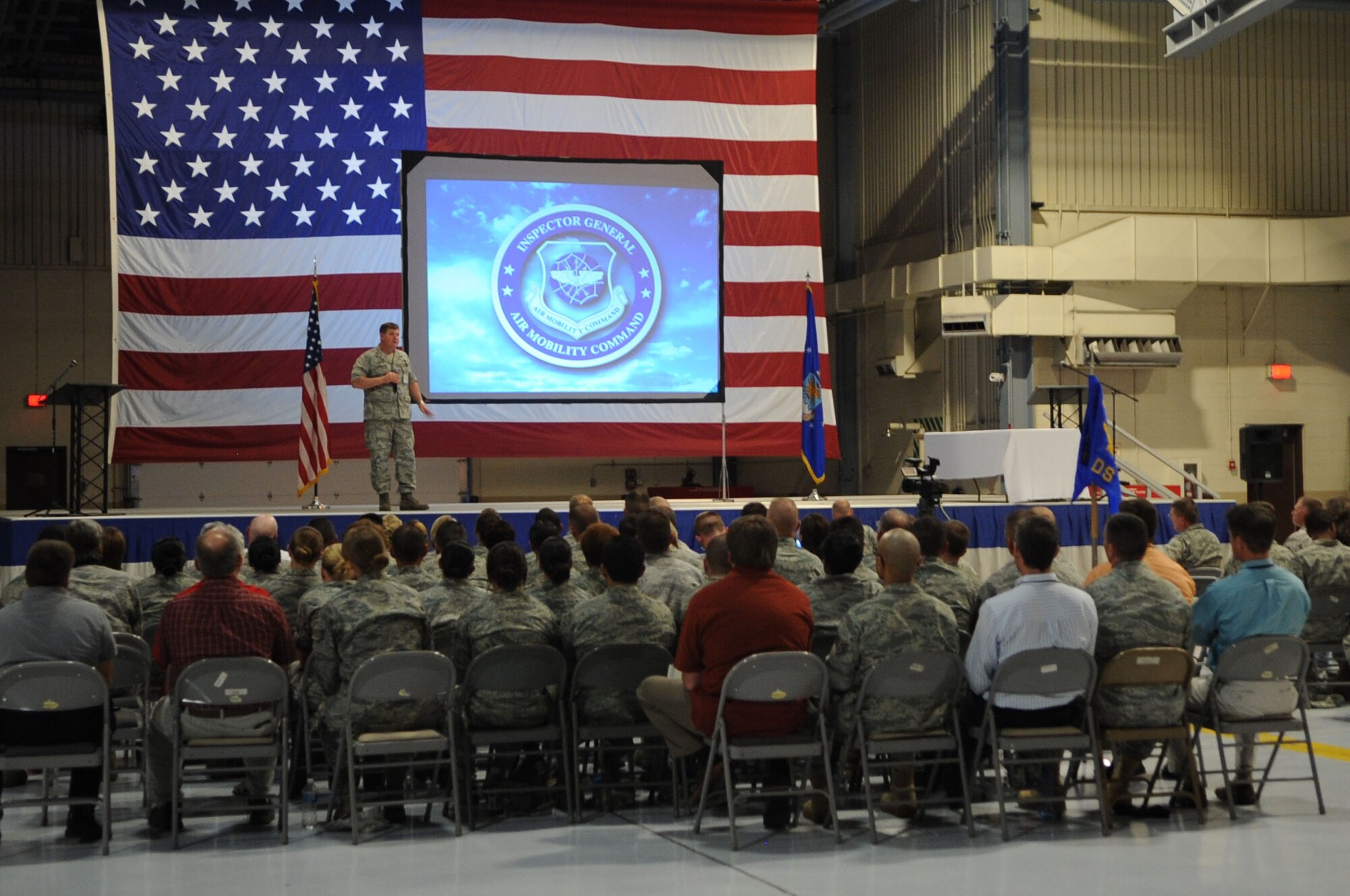 Col. Steven LeGrand, Inspector General, speaks to members of Grand Forks Air Force Base during a Compliance Inspection de-brief on GFAFB Aug 9. A CI is an inspection conducted to assess areas mandated by law, as well as mission areas identified by leadership as critical or important to the health and performance of a unit. The 319th Air Base Wing received an overall rating of "excellent".  (U.S. Air Force photo by Senior Airman Amanda N. Stencil)