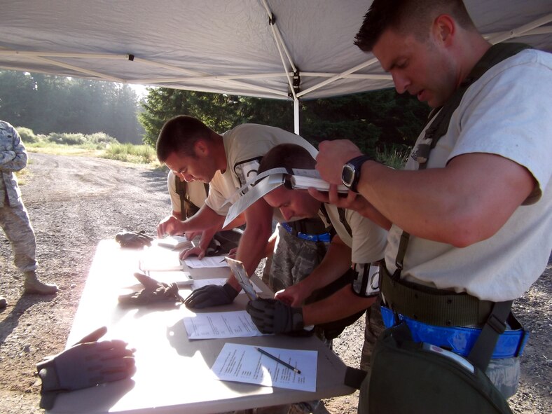 67th aerial porters test their familiarity with the Airman’s Manual during the challenge course at the Air Mobility Rodeo competition. (Courtesy photo)