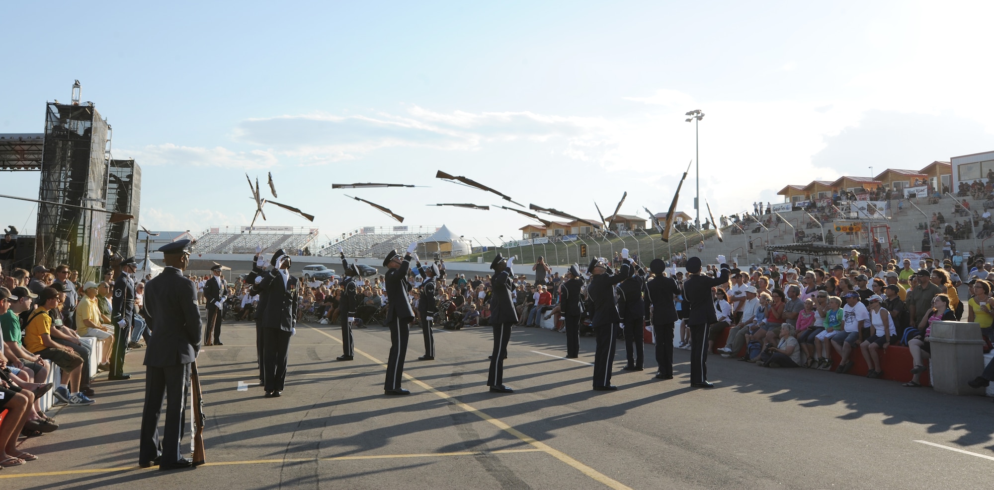 The U.S. Air Force Honor Guard Drill Team tosses their M-1 rifles into the air during a performance at the annual Cameco Canada Remembers International Festival for Heroes Air Show in Saskatoon, Canada Aug. 6. “The drill team did a tremendous job this weekend here in Saskatoon, they performed with exemplarily professionalism, accuracy and precision” said Canadian Forces Capt. Marc Velasco, 431st Air Demonstration Squadron, public affairs officer ”it was quite an amazing show and an excellent job of representing the United state air force” (U.S. Air Force photo by Staff Sgt. Christopher Ruano)
