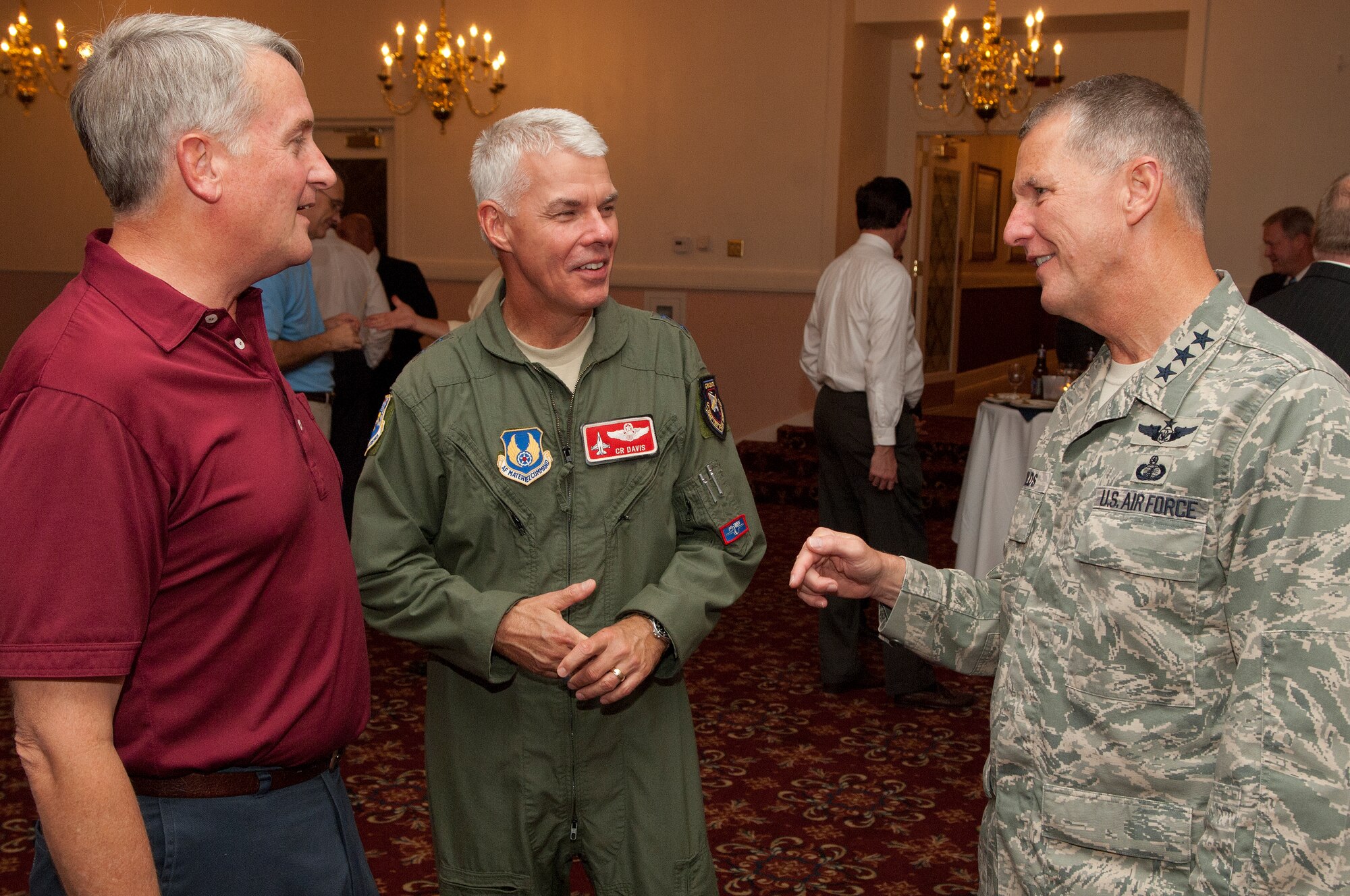 Maj. Gen. David Eichhorn (left), Air Force Operational Test and Evaluation Center commander, Maj. Gen. Charles Davis (center), Air Armament Center commander,  and Electronic Systems Center Commander Lt. Gen. Ted Bowlds chat during a social Wednesday evening at Hanscom’s Minuteman Commons.  All three, along with many other Air Force senior leaders, have been participating in the Executive Weapon System Review held at Hanscom and MIT Lincoln Laboratory this week.  The three generals all have ESC connections; General Davis will take command of the center from General Bowlds Sept 1, and General Eichhorn previously served as ESC’s vice commander.