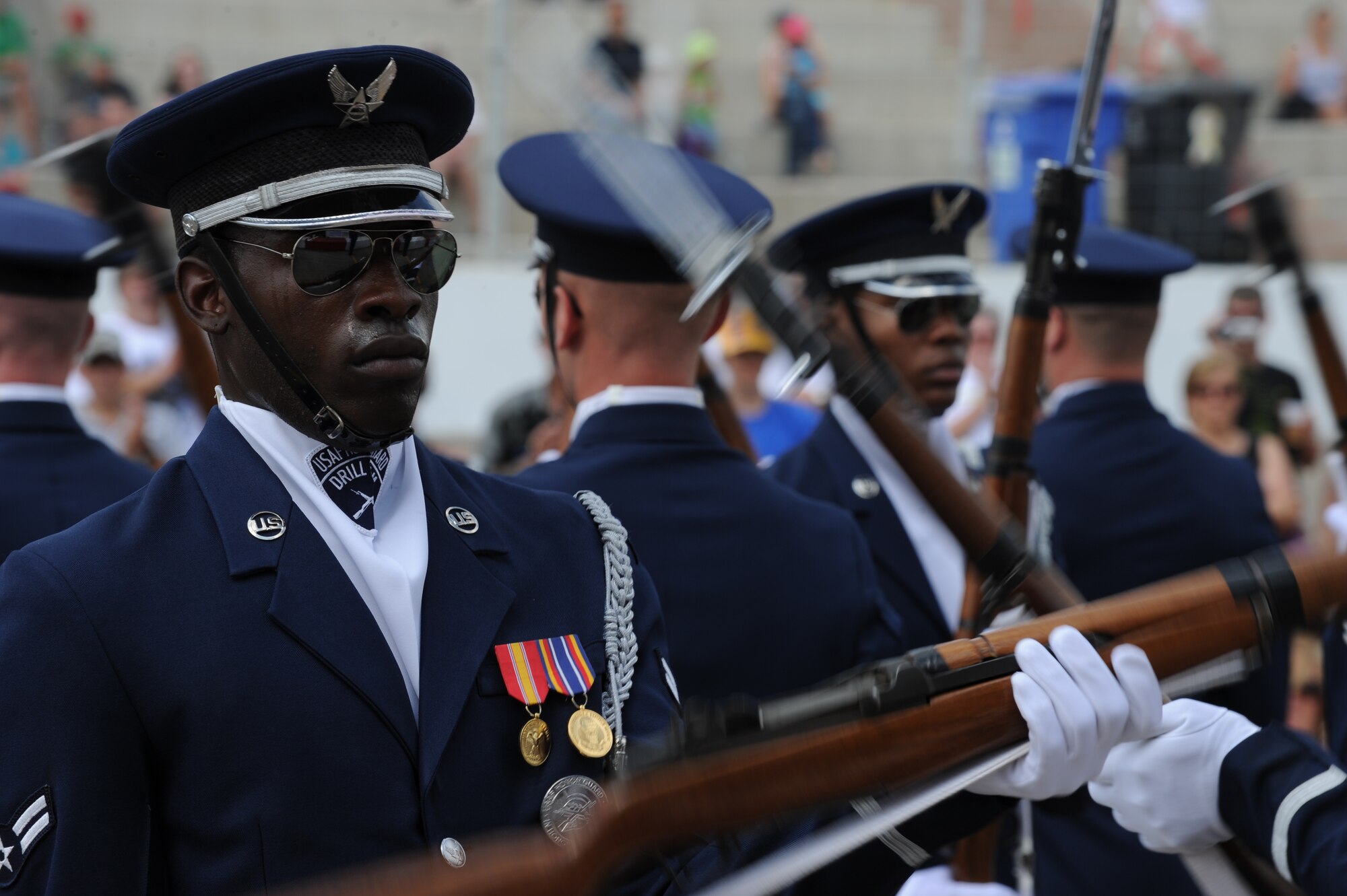 Airmen 1st Class Billy Degraffenreid, U.S. Air Force Honor Guard Drill Team member, performs at the annual Cameco Canada Remembers International Festival for Heroes Air Show in Saskatoon, Canada Aug. 6. "Our goal here was to honor all those who have given their lives defending freedom past and present through the pride and precision exemplified by the USAF Honor Guard Drill Team," said Master Sgt. Nathan Todd, Drill Team flight chief. (U.S. Air Force photo by Staff Sgt. Christopher Ruano)

