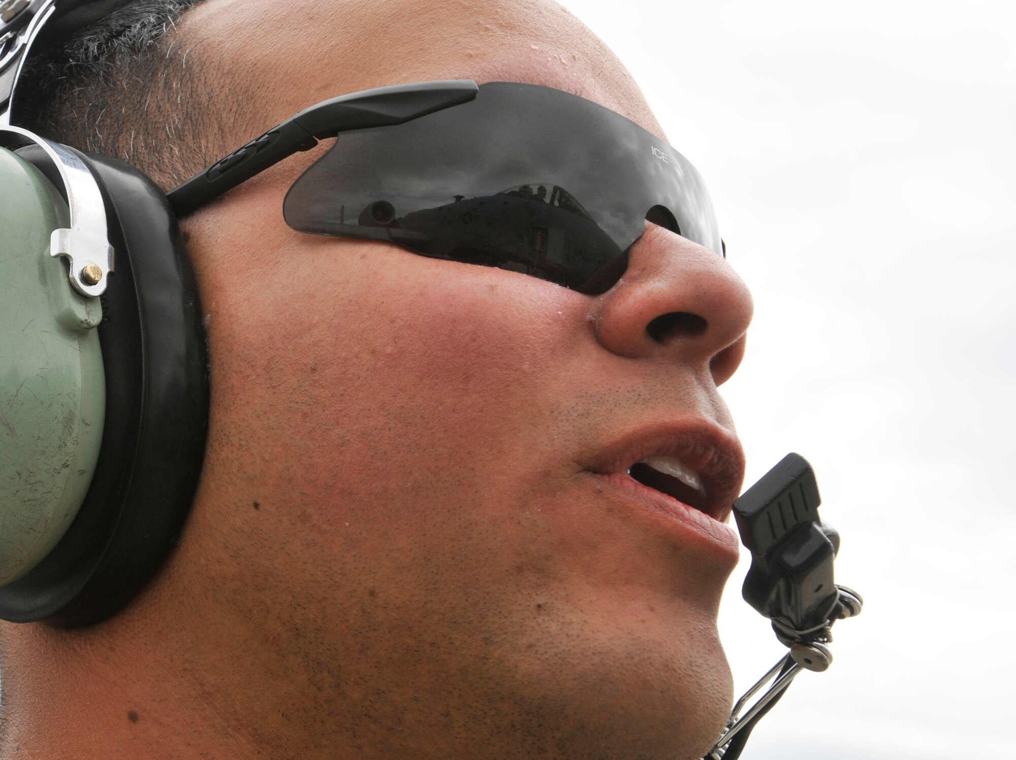 ROYAL AIR FORCE LAKENHEATH, England - Senior Airman Rene Medina, 81st Air Mobility Unit, 52nd Aircraft Maintenance Squadron crew chief, speaks with an A-10 Thunderbolt II pilot, during pre-flight checks at RAF Lakenheath, Aug. 10, 2011. The A-10s are here in support of a U.K.-led exercise. (U.S. Air Force photo/Senior Airman Tiffany M. Deuel)