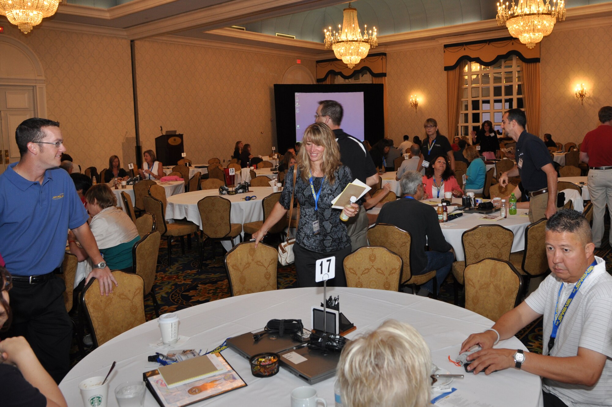 Program Managers, Directors and Instructors take their seats in preparation for the opening plenary session of the 2011 DoD STARBASE Program Conference at the J.W Marriott Hotel in New Orleans, July 9, 2011. Brig. Gen. John J. Mooney III, the commander of the 307th Bomb Wing at Barksdale Air Force Base, La., was the first guest speaker for the three-day event. The DoD STARBASE program has an annual Director's conference and a bi-annual Instructor's conference. This year, for the first time, the two conferences were held in tandem. (U.S. Air Force photo/Tech. Sgt. Jeff Walston)