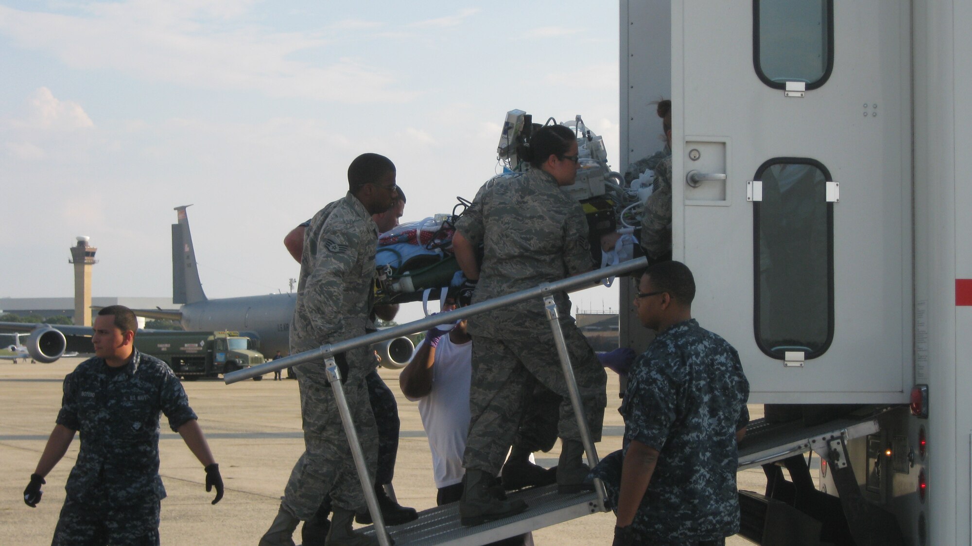 A critical care patient is moved to the Walter Reed patient transport vehicle by aeromedical staging facility personnel. The Joint Base Andrews, Md. Aeromedical Staging Facility is the busiest ASF in the United States. Each week more than 100 sick or injured patients are brought in from Europe, Africa, and the Middle East to the United States for care. Combat troops typically arrive here within 72 hours of suffering a severe battlefield injury. (U.S. Air Force photo by Melanie Moore)
