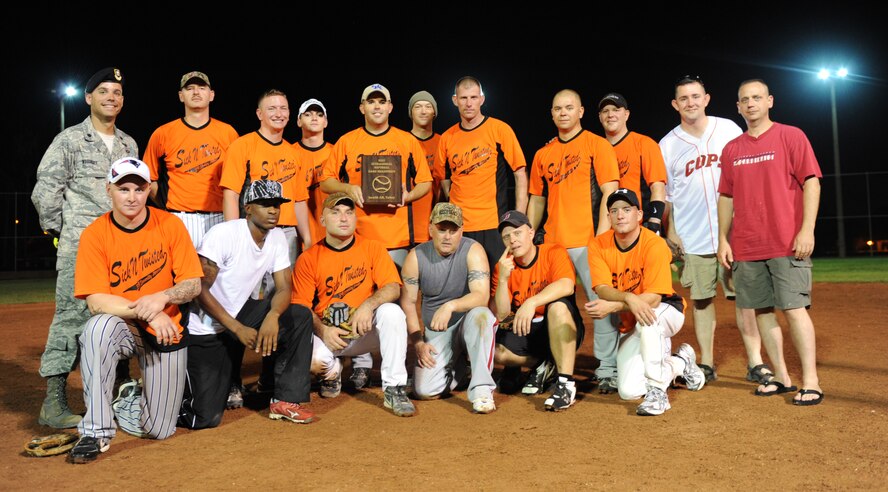 The 39th Security Forces Squadron softball team poses for a group photo after their win in the base softball championship Aug. 9, 2011, at Incirlik Air Base, Turkey. The 39th SFS team played the 39th Logistics Readiness Squadron in the base championship, which consisted of two games, 39th LRS won the first game 11-8, and the 39th SFS won the title in the second game with a score of 13-2. (U.S. Air Force photo by Senior Airman Anthony Sanchelli/Released)