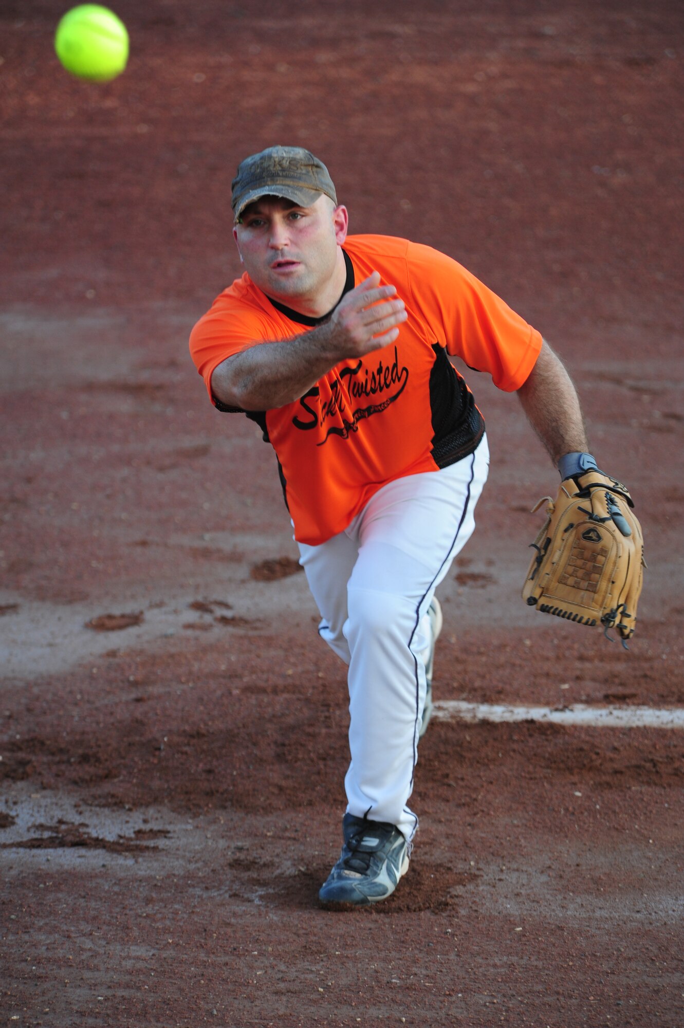 Forrest Richardson, 39th Security Forces Squadron, pitches during an annual softball championship game Aug. 9, 2011, at Incirlik Air Base, Turkey. The 39th SFS team played the 39th Logistics Readiness Squadron in the base championship, which consisted of two games. The 39th LRS won the first game 11-8, and the 39th SFS won the title in the second game with a score of 13-2. (U.S. Air Force photo by Senior Airman Anthony Sanchelli/Released) 