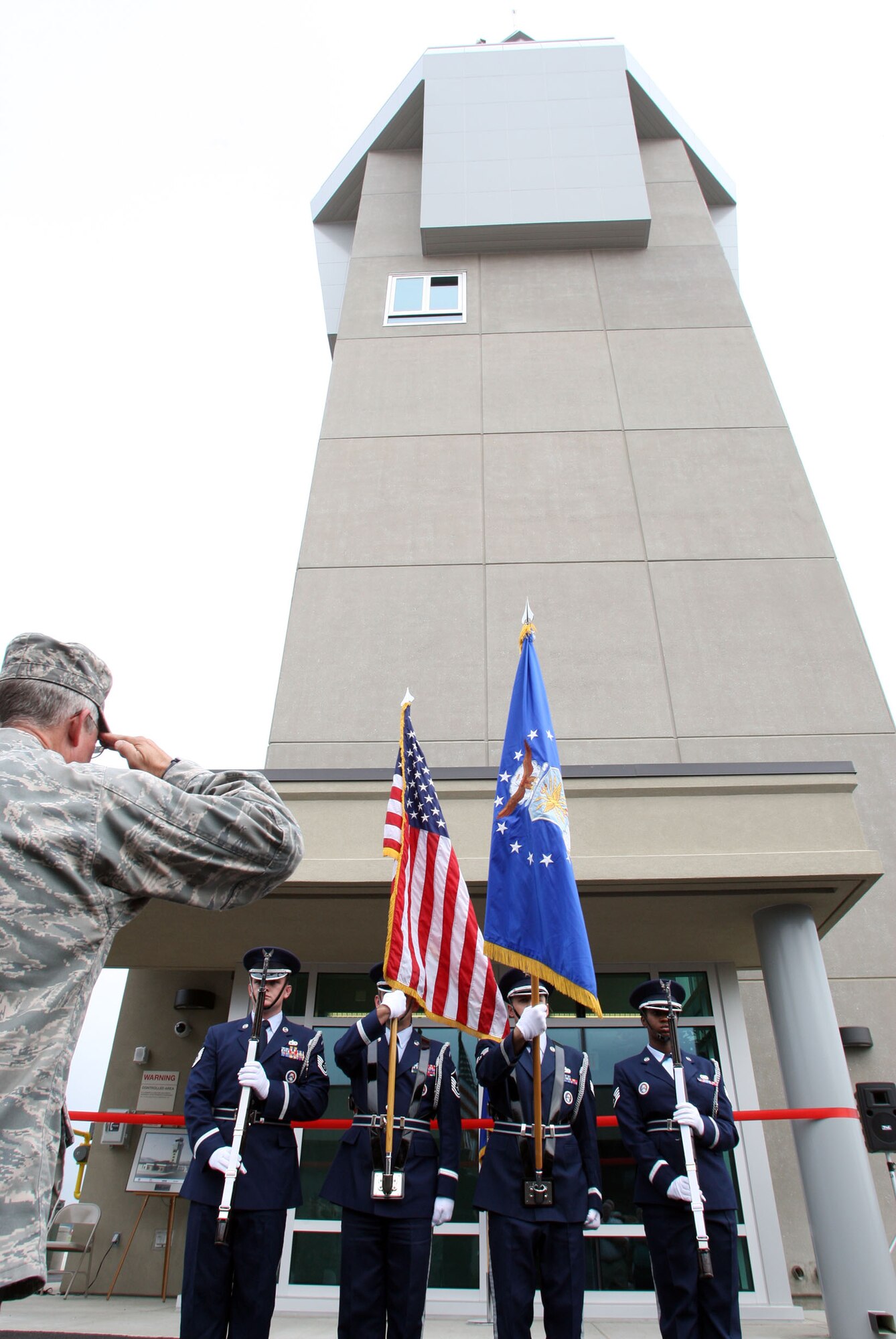 Members of the Dobbins 94th Airlift Wing honor guard present colors during the National Anthem at the commemoration of the opening of the Air Traffic Control tower held Aug. 9. (U.S. Air Force photo/Don Peek) 