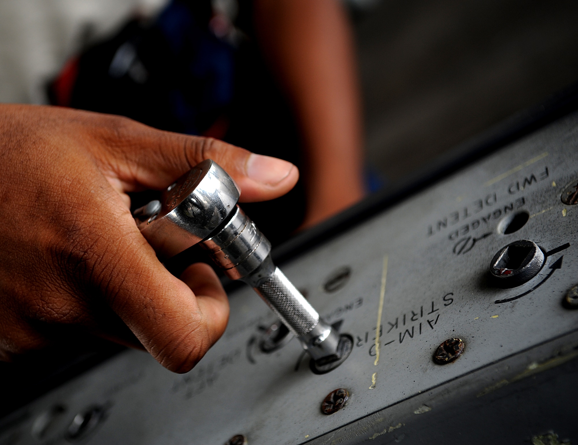 Senior Airman Marcus Cannon, 18th Aircraft Maintenance Squadron crew chief, prepares an F-15 wing pylon for attachment during Beverly High 11-6, a Local Operational Readiness Exercise on Kadena Air Base, Japan, Aug. 10. During the LORE, Airmen sharpen skills required during normal and contingncy operations. (U.S. Air Force photo/Staff Sgt. Christopher Hummel)