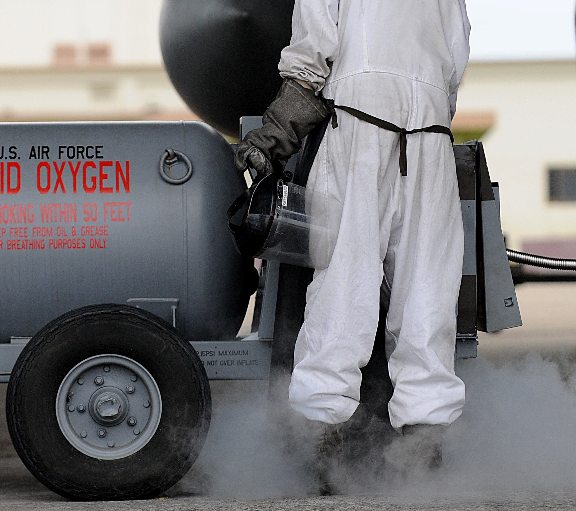 Senior Airman Dennis Gnoski, 18th Aircraft Maintenance Squadron crew chief, services a F-15 Eagle with liquid oxygen during Beverly High 11-6, a Local Operational Readiness Exercise on Kadena Air Base, Japan, Aug. 10. During the LORE, Airmen sharpen skills required during normal and contingncy operations. (U.S. Air Force photo/Staff Sgt. Christopher Hummel)