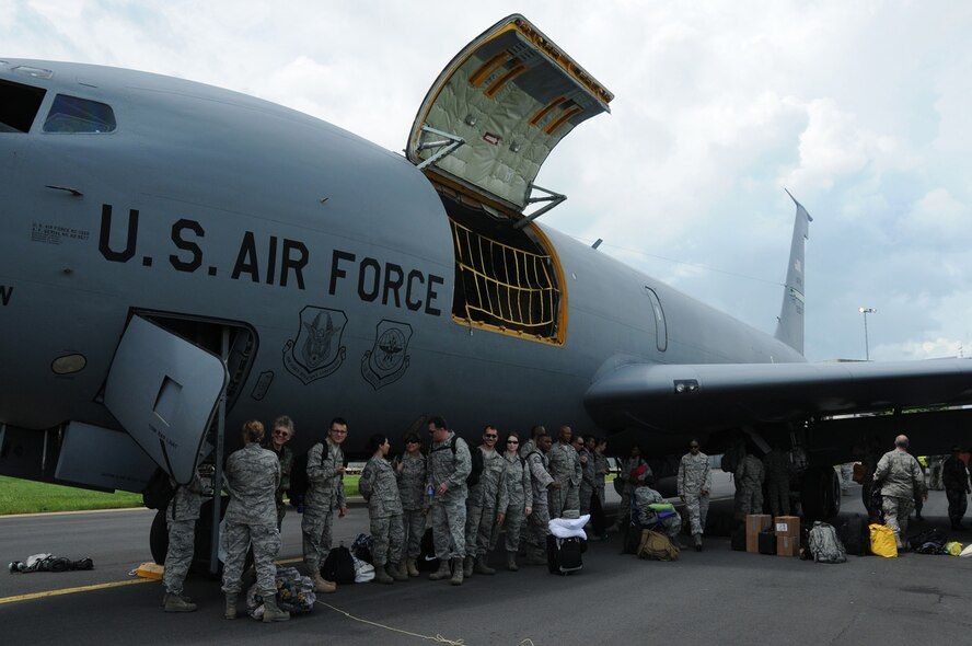 MANAGUA, NICARAGUA -- Reservists from the 916th Aerospace Medicine Squadron stationed at Seymour Johnson Air Force Base, N.C. and volunteer medical providers from several other locations, take refuge in the shade of a KC-135R Stratotanker that transported them here Aug. 6, 2011 to complete a Medical Readiness Exercise, or MEDRETE.  The group plans to provide free care to roughly 10,000 indigent citizens during their mission. (USAF photo by Senior Airman Meredith A. H. Thomas, 916 ARW/PA)