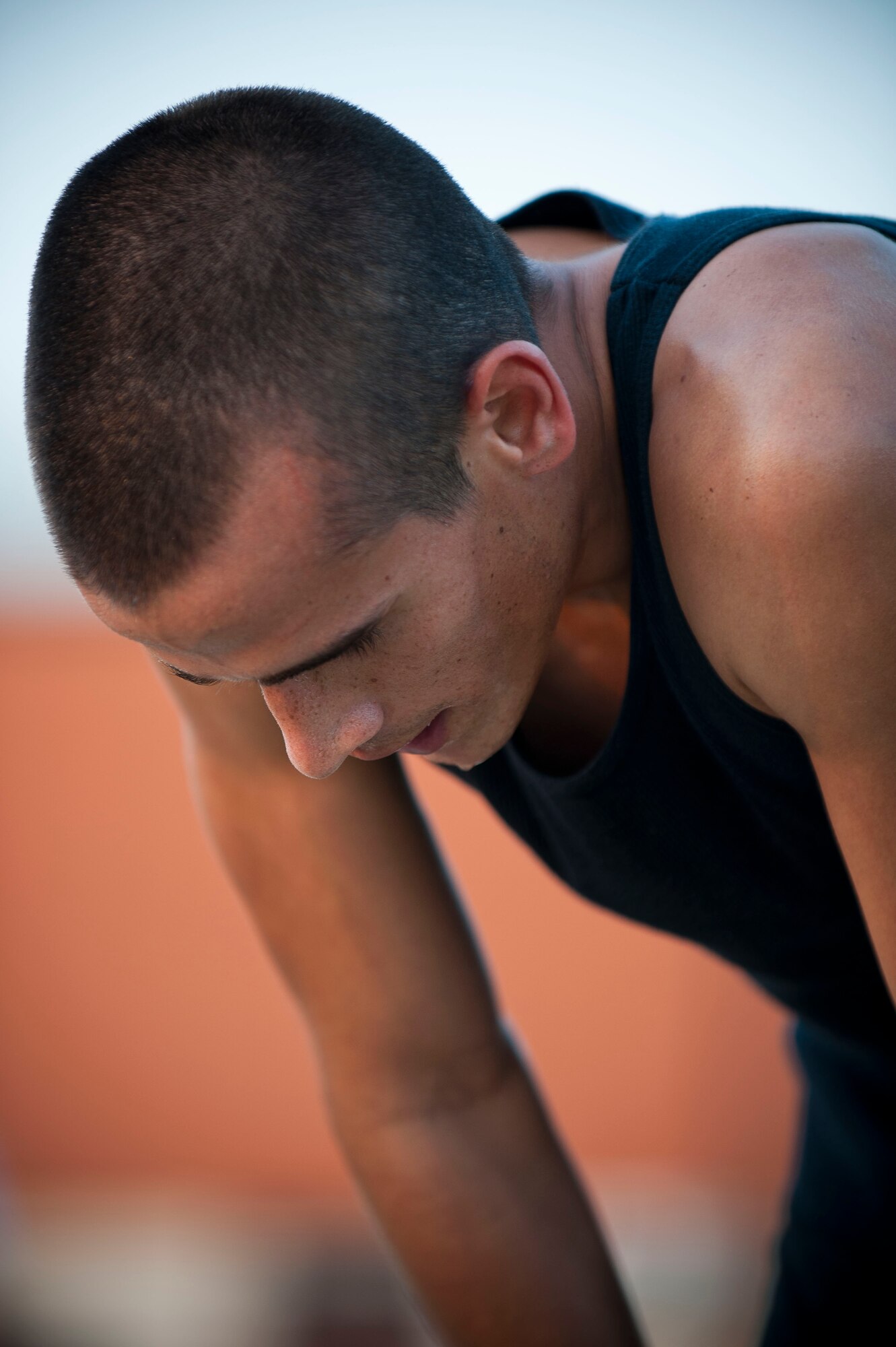 Staff Sgt. Joshua Acosta, 39th Logistics Readiness Squadron, recovers during an Incirlik Running Club session at the track Aug. 10, 2011, at Incirlik Air Base Turkey. The Incirlik Running Club's overall goal is to prepare Airmen for Incirlik's Half Marathon and Istanbul's Marathon. (U.S. Air Force photo by Airman 1st Class Clayton Lenhardt/Released)