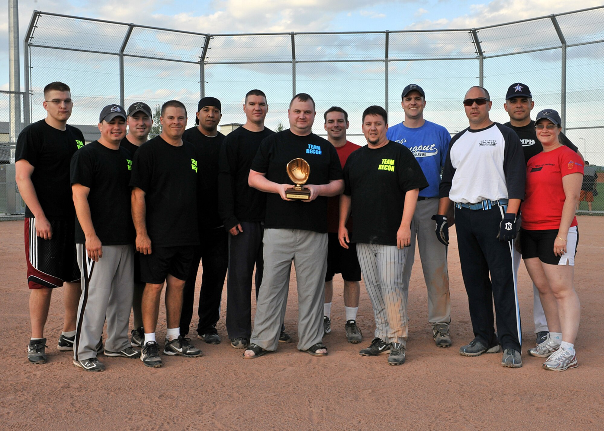 RAF MILDENHALL, England -- Members of the 488th Intelligence and 95th Reconnaissance Squadrons’ softball team pose with their trophy after winning the Team Mildenhall Intramural Softball Championship here Aug. 9, 2011.  The 488th IS/95th RS softball team played the 352nd Special Operations Group with a final score of 20-8.  (U.S. Air Force photo/Staff Sgt. Tabitha M. Lee)