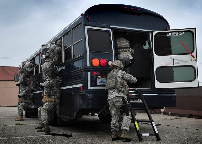14 of the 27 Airman who volunteered, remain here, August 10. Day two and three of the QRT training, rigorous physical training continued as obstacles increased with difficulty testing [their] strength, hand-eye coordination and communications skills. SF Airmen were taught how to  breech/clear buildings  and received certification in the use of simulated ground burst projectiles.  Day four SF Airmen performe active shooter on a bus scenarios.  Physical training sessions were themed in memory of the 31 warriors lost in Afghanistan, August 7, by each volunteer completing 31 of each exercise throughout the course. A QRT member provides immediate response to any high risk situation on Osan Air Base to include barricaded suspects, workplace violence, domestic violence and abuse response, school violence, and disaster response.  (U.S. Air Force Photo by/Staff Sgt. Daylena Gonzalez)

