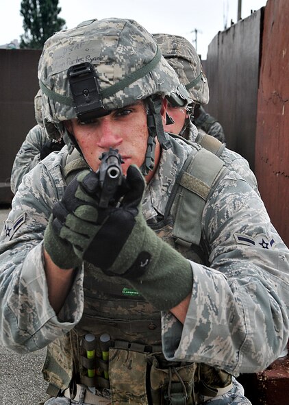 14 of the 27 Airman who volunteered, remain here, August 10. Day two and three of the QRT training, rigorous physical training continued as obstacles increased with difficulty testing [their] strength, hand-eye coordination and communications skills. SF Airmen were taught how to  breech/clear buildings  and received certification in the use of simulated ground burst projectiles.  Day four SF Airmen performe active shooter on a bus scenarios.  Physical training sessions were themed in memory of the 31 warriors lost in Afghanistan, August 7, by each volunteer completing 31 of each exercise throughout the course. A QRT member provides immediate response to any high risk situation on Osan Air Base to include barricaded suspects, workplace violence, domestic violence and abuse response, school violence, and disaster response.  (U.S. Air Force Photo by/Staff Sgt. Daylena Gonzalez)

