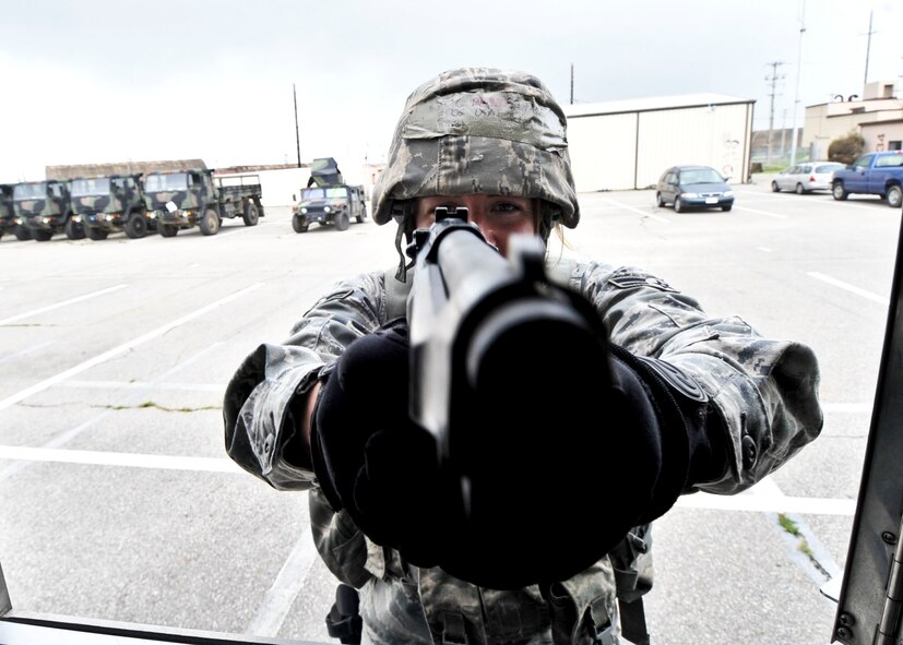 14 of the 27 Airman who volunteered, remain here, August 10. Day two and three of the QRT training, rigorous physical training continued as obstacles increased with difficulty testing not only their strength but also their capabilities to act as a cohesive squad. SF Airmen were taught how to breech/clear buildings and received certification in the use of simulated ground burst projectiles. Day four SF Airmen performed active shooter scenarios on a bus.  Physical training sessions were themed in memory of the 31 warriors lost in Afghanistan, August 7, by each volunteer completing 31 of each exercise throughout the course. A QRT member provides immediate response to any high risk situation on Osan Air Base to include barricaded suspects, workplace violence, domestic violence and abuse response, school violence, and disaster response. (U.S. Air Force Photos by/ Senior Airman Adam Grant)