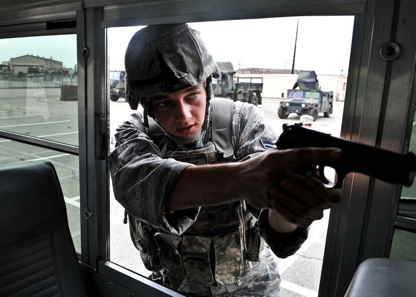 14 of the 27 Airman who volunteered, remain here, August 10. Day two and three of the QRT training, rigorous physical training continued as obstacles increased with difficulty testing not only their strength but also their capabilities to act as a cohesive squad. SF Airmen were taught how to breech/clear buildings and received certification in the use of simulated ground burst projectiles. Day four SF Airmen performed active shooter scenarios on a bus.  Physical training sessions were themed in memory of the 31 warriors lost in Afghanistan, August 7, by each volunteer completing 31 of each exercise throughout the course. A QRT member provides immediate response to any high risk situation on Osan Air Base to include barricaded suspects, workplace violence, domestic violence and abuse response, school violence, and disaster response. (U.S. Air Force Photos by/ Senior Airman Adam Grant)