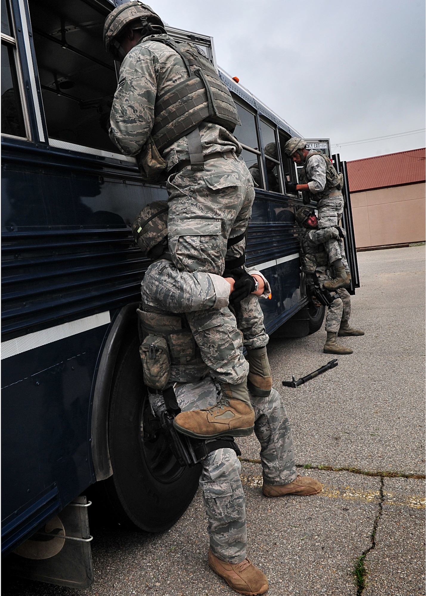 14 of the 27 Airman who volunteered, remain here, August 10. Day two and three of the QRT training, rigorous physical training continued as obstacles increased with difficulty testing [their] strength, hand-eye coordination and communications skills. SF Airmen were taught how to  breech/clear buildings  and received certification in the use of simulated ground burst projectiles.  Day four SF Airmen performe active shooter on a bus scenarios.  Physical training sessions were themed in memory of the 31 warriors lost in Afghanistan, August 7, by each volunteer completing 31 of each exercise throughout the course. A QRT member provides immediate response to any high risk situation on Osan Air Base to include barricaded suspects, workplace violence, domestic violence and abuse response, school violence, and disaster response.  (U.S. Air Force Photo by/Staff Sgt. Daylena Gonzalez)

