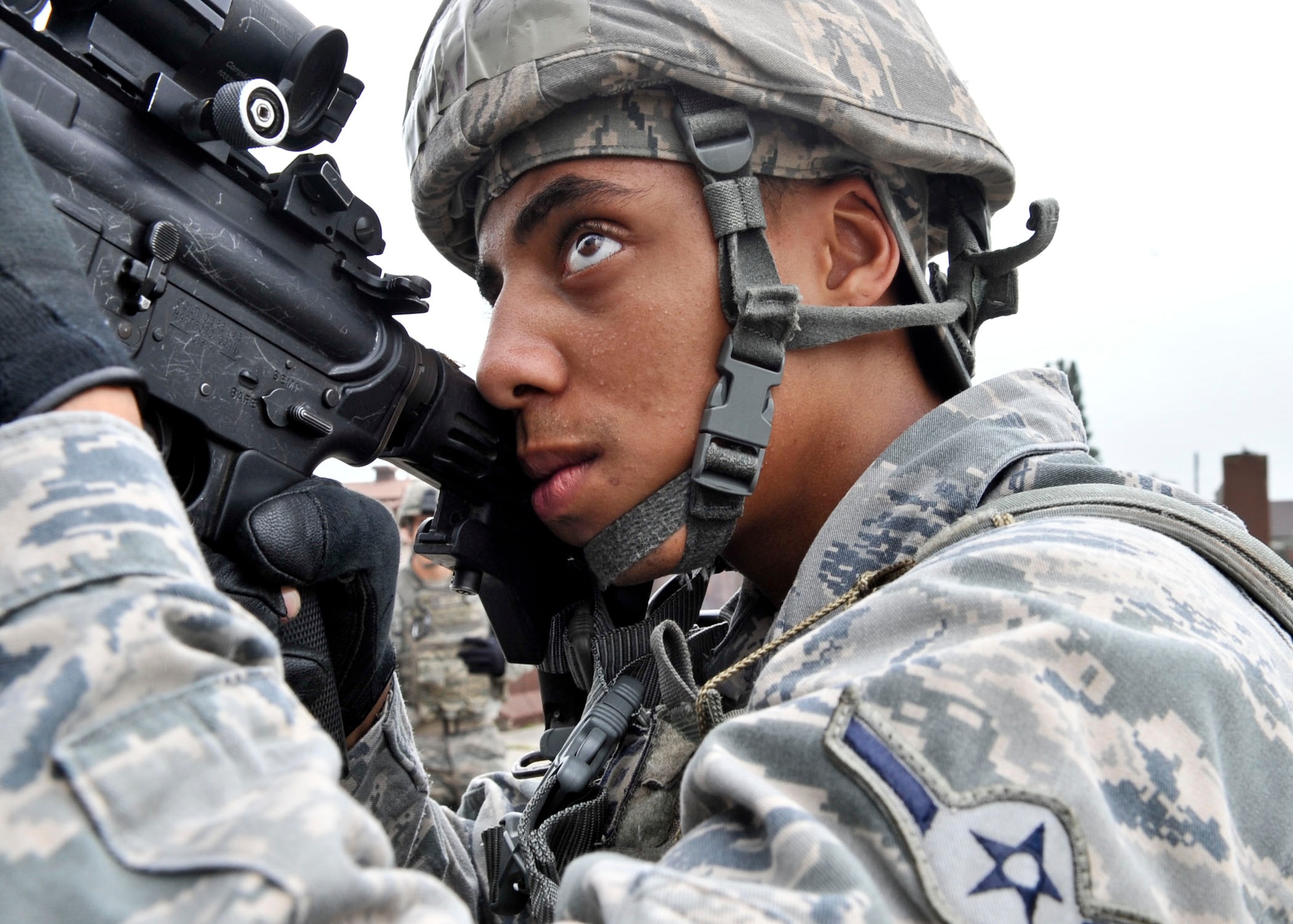 14 of the 27 Airman who volunteered, remain here, August 10. Day two and three of the QRT training, rigorous physical training continued as obstacles increased with difficulty testing not only their strength but also their capabilities to act as a cohesive squad. SF Airmen were taught how to breech/clear buildings and received certification in the use of simulated ground burst projectiles. Day four SF Airmen performed active shooter scenarios on a bus.  Physical training sessions were themed in memory of the 31 warriors lost in Afghanistan, August 7, by each volunteer completing 31 of each exercise throughout the course. A QRT member provides immediate response to any high risk situation on Osan Air Base to include barricaded suspects, workplace violence, domestic violence and abuse response, school violence, and disaster response. (U.S. Air Force Photos by/ Senior Airman Adam Grant)