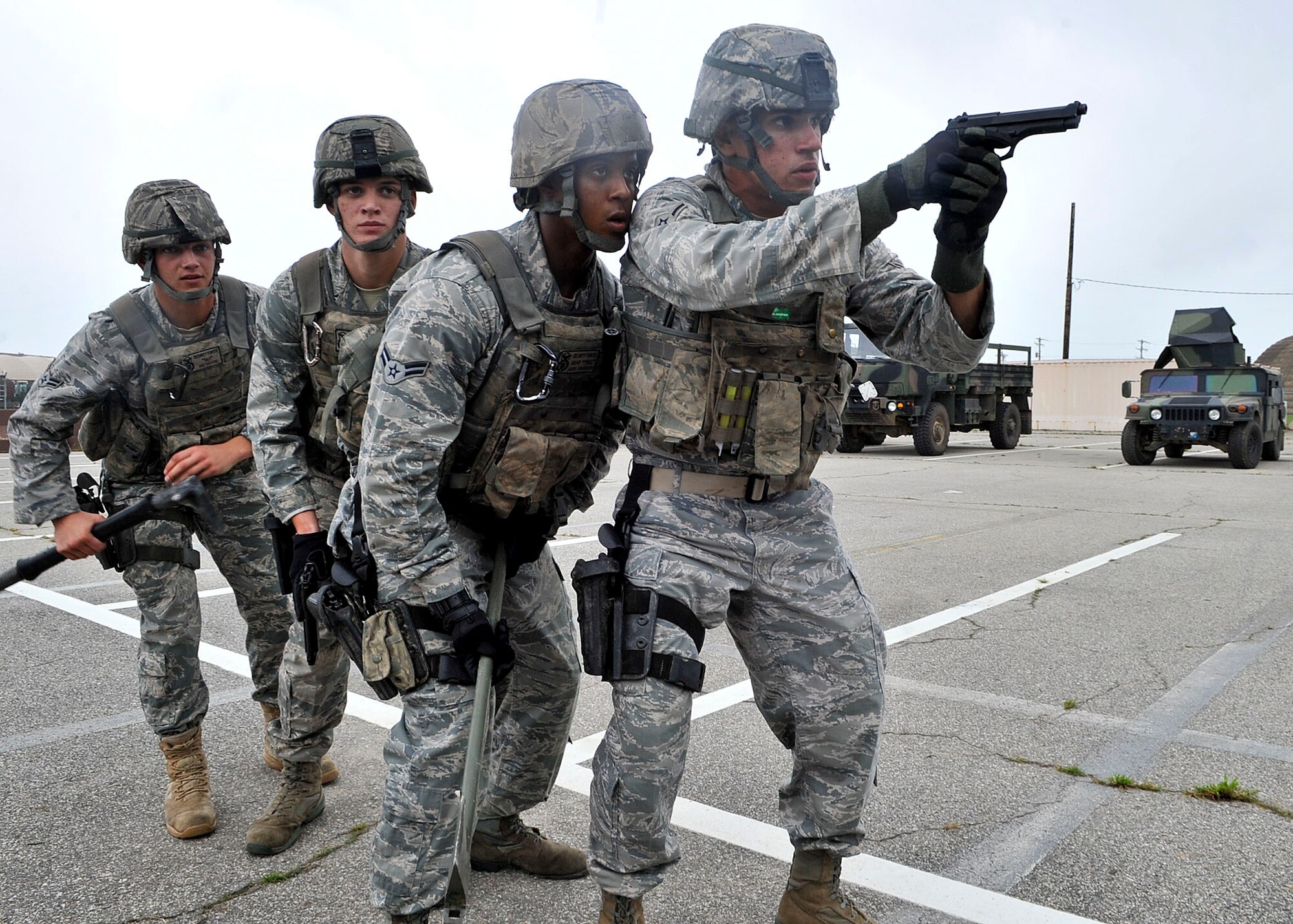 14 of the 27 Airman who volunteered, remain here, August 10. Day two and three of the QRT training, rigorous physical training continued as obstacles increased with difficulty testing not only their strength but also their capabilities to act as a cohesive squad. SF Airmen were taught how to breech/clear buildings and received certification in the use of simulated ground burst projectiles. Day four SF Airmen performed active shooter scenarios on a bus.  Physical training sessions were themed in memory of the 31 warriors lost in Afghanistan, August 7, by each volunteer completing 31 of each exercise throughout the course. A QRT member provides immediate response to any high risk situation on Osan Air Base to include barricaded suspects, workplace violence, domestic violence and abuse response, school violence, and disaster response. (U.S. Air Force Photos by/ Senior Airman Adam Grant)