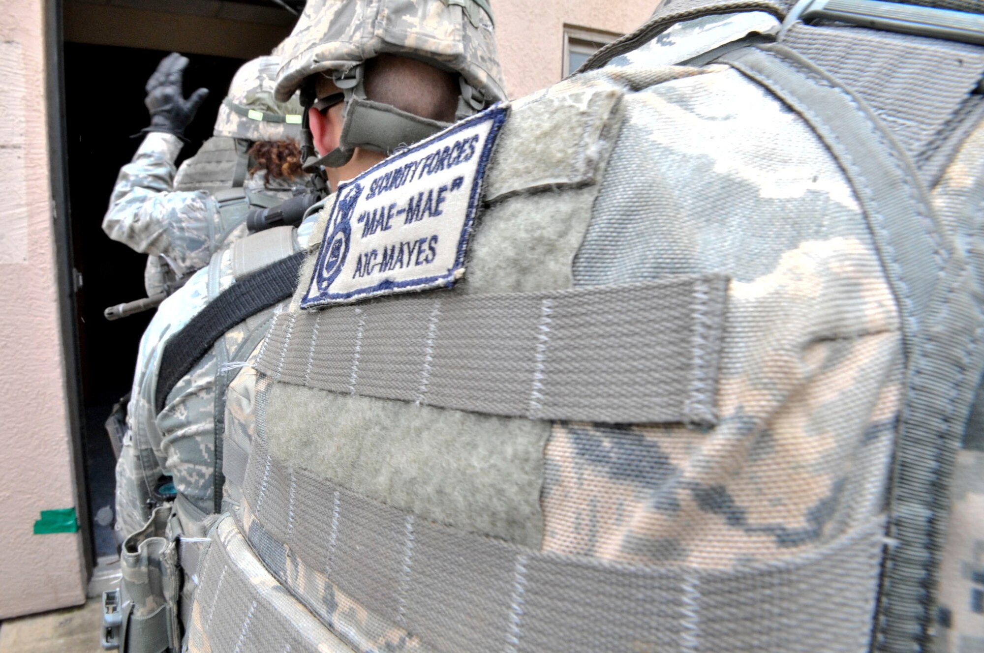 14 of the 27 Airman who volunteered, remain here, August 10. Day two and three of the QRT training, rigorous physical training continued as obstacles increased with difficulty testing not only their strength but also their capabilities to act as a cohesive squad. SF Airmen were taught how to breech/clear buildings and received certification in the use of simulated ground burst projectiles. Day four SF Airmen performed active shooter scenarios on a bus.  Physical training sessions were themed in memory of the 31 warriors lost in Afghanistan, August 7, by each volunteer completing 31 of each exercise throughout the course. A QRT member provides immediate response to any high risk situation on Osan Air Base to include barricaded suspects, workplace violence, domestic violence and abuse response, school violence, and disaster response. (U.S. Air Force Photos by/ Senior Airman Adam Grant)