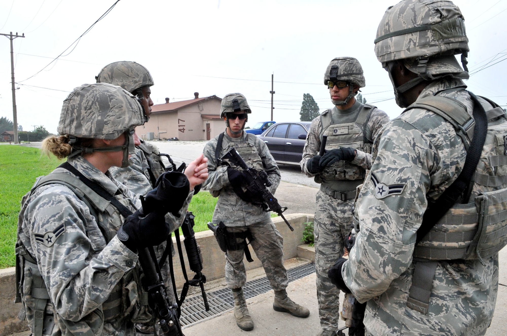 14 of the 27 Airman who volunteered, remain here, August 10. Day two and three of the QRT training, rigorous physical training continued as obstacles increased with difficulty testing not only their strength but also their capabilities to act as a cohesive squad. SF Airmen were taught how to breech/clear buildings and received certification in the use of simulated ground burst projectiles. Day four SF Airmen performed active shooter scenarios on a bus.  Physical training sessions were themed in memory of the 31 warriors lost in Afghanistan, August 7, by each volunteer completing 31 of each exercise throughout the course. A QRT member provides immediate response to any high risk situation on Osan Air Base to include barricaded suspects, workplace violence, domestic violence and abuse response, school violence, and disaster response. (U.S. Air Force Photos by/ Senior Airman Adam Grant)