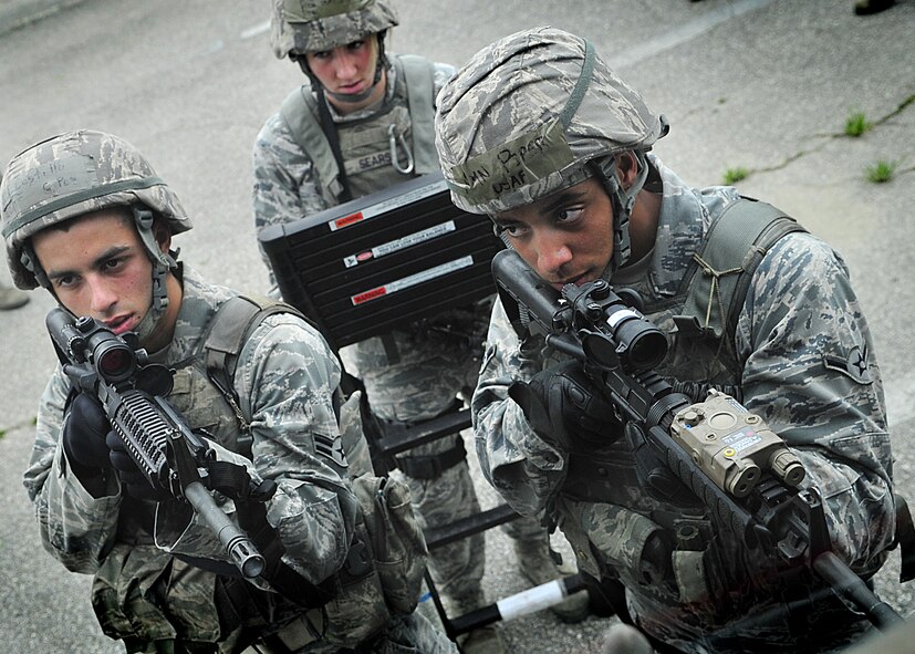 14 of the 27 Airman who volunteered, remain here, August 10. Day two and three of the QRT training, rigorous physical training continued as obstacles increased with difficulty testing [their] strength, hand-eye coordination and communications skills. SF Airmen were taught how to  breech/clear buildings  and received certification in the use of simulated ground burst projectiles.  Day four SF Airmen performe active shooter on a bus scenarios.  Physical training sessions were themed in memory of the 31 warriors lost in Afghanistan, August 7, by each volunteer completing 31 of each exercise throughout the course. A QRT member provides immediate response to any high risk situation on Osan Air Base to include barricaded suspects, workplace violence, domestic violence and abuse response, school violence, and disaster response.  (U.S. Air Force Photo by/Staff Sgt. Daylena Gonzalez)

