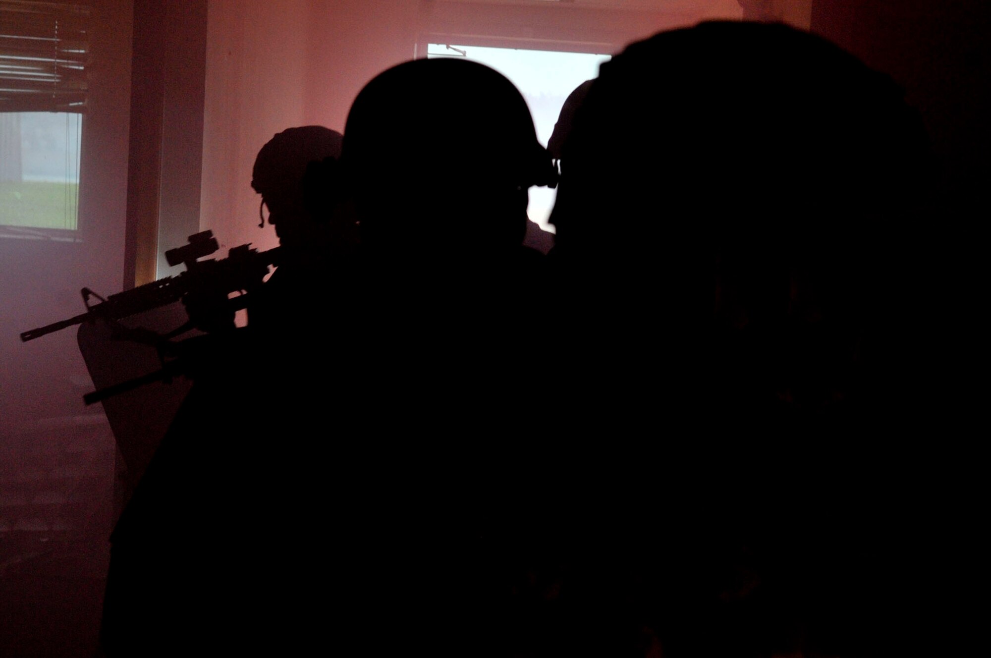 14 of the 27 Airman who volunteered, remain here, August 10. Day two and three of the QRT training, rigorous physical training continued as obstacles increased with difficulty testing not only their strength but also their capabilities to act as a cohesive squad. SF Airmen were taught how to breech/clear buildings and received certification in the use of simulated ground burst projectiles. Day four SF Airmen performed active shooter scenarios on a bus.  Physical training sessions were themed in memory of the 31 warriors lost in Afghanistan, August 7, by each volunteer completing 31 of each exercise throughout the course. A QRT member provides immediate response to any high risk situation on Osan Air Base to include barricaded suspects, workplace violence, domestic violence and abuse response, school violence, and disaster response. (U.S. Air Force Photos by/ Senior Airman Adam Grant)