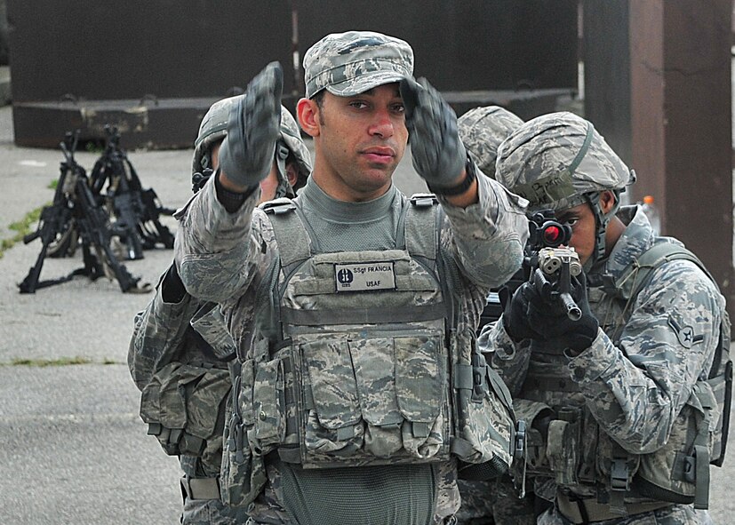 14 of the 27 Airman who volunteered, remain here, August 10. Day two and three of the QRT training, rigorous physical training continued as obstacles increased with difficulty testing [their] strength, hand-eye coordination and communications skills. SF Airmen were taught how to  breech/clear buildings  and received certification in the use of simulated ground burst projectiles.  Day four SF Airmen performe active shooter on a bus scenarios.  Physical training sessions were themed in memory of the 31 warriors lost in Afghanistan, August 7, by each volunteer completing 31 of each exercise throughout the course. A QRT member provides immediate response to any high risk situation on Osan Air Base to include barricaded suspects, workplace violence, domestic violence and abuse response, school violence, and disaster response.  (U.S. Air Force Photo by/Staff Sgt. Daylena Gonzalez)


