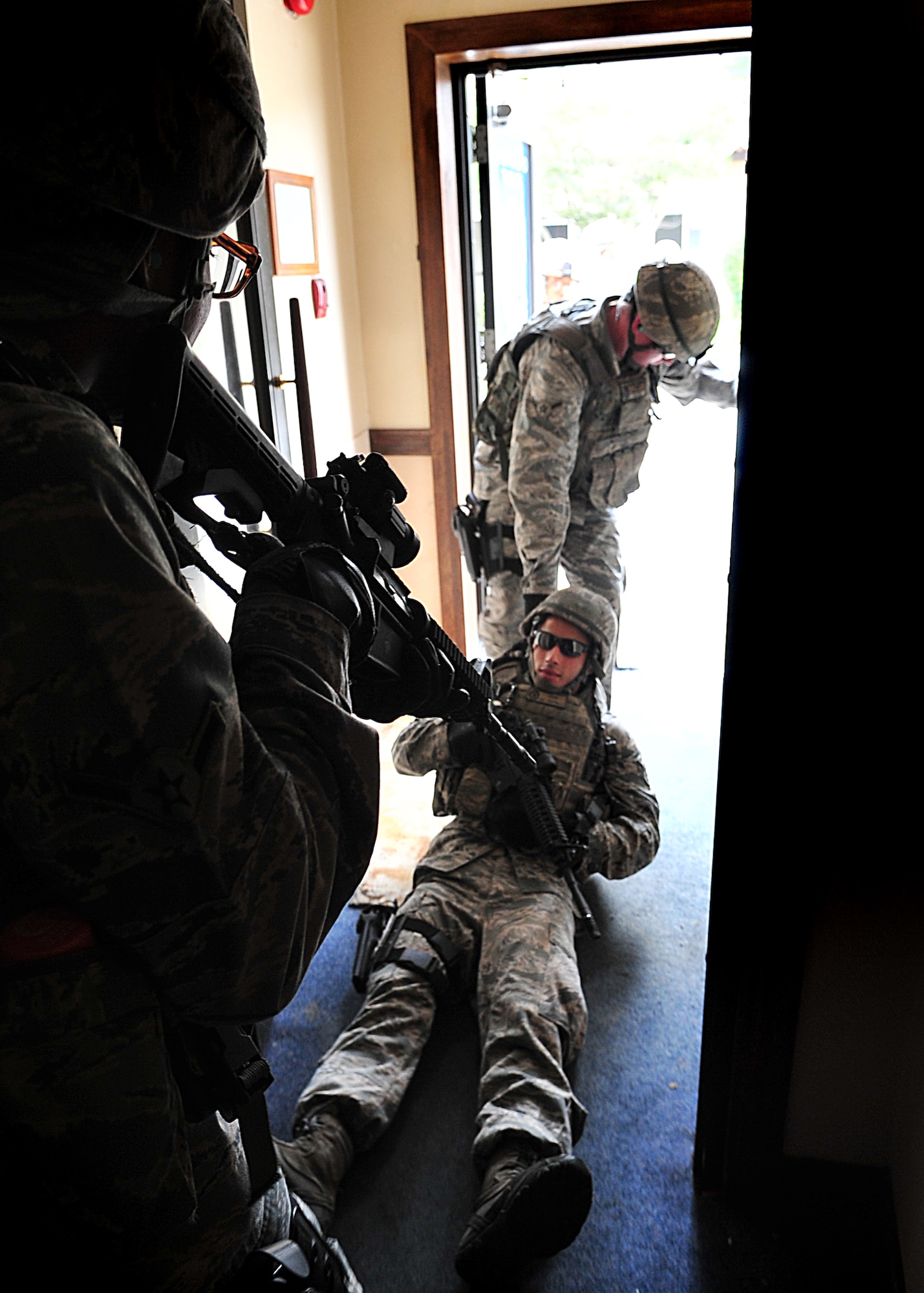 14 of the 27 Airman who volunteered, remain here, August 10. Day two and three of the QRT training, rigorous physical training continued as obstacles increased with difficulty testing [their] strength, hand-eye coordination and communications skills. SF Airmen were taught how to  breech/clear buildings  and received certification in the use of simulated ground burst projectiles.  Day four SF Airmen performe active shooter on a bus scenarios.  Physical training sessions were themed in memory of the 31 warriors lost in Afghanistan, August 7, by each volunteer completing 31 of each exercise throughout the course. A QRT member provides immediate response to any high risk situation on Osan Air Base to include barricaded suspects, workplace violence, domestic violence and abuse response, school violence, and disaster response.  (U.S. Air Force Photo by/Staff Sgt. Daylena Gonzalez)

