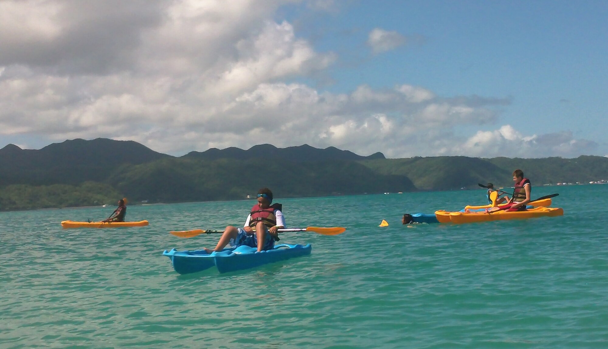 Operation Purple Camp participants kayak in the waters of Okuma Recreation Facility Aug. 2 on Okinawa, Japan. Dion Bass, Kadena Teen Center director, and Geoffrey Rinehart, Kadena Youth Center director, teamed up with the National Military Family Association to bring Operation Purple Camp to Okinawa this year for the first time since its inception in 2004. (Courtesy photo)