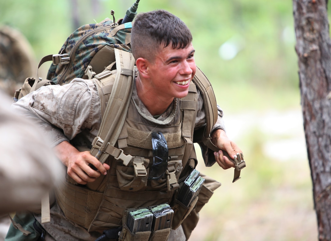 Lance Cpl. Timothy Coker, a rifleman with Bravo Company, 1st Battalion, 2nd Marine Regiment, 2nd Marine Division, conduct a mile-long squad patrol during a field exercise here, Aug. 11. The training was part of a week-long operation to prepare Marines and Sailors for their upcoming deployment with the 24th Marine Expeditionary Unit.